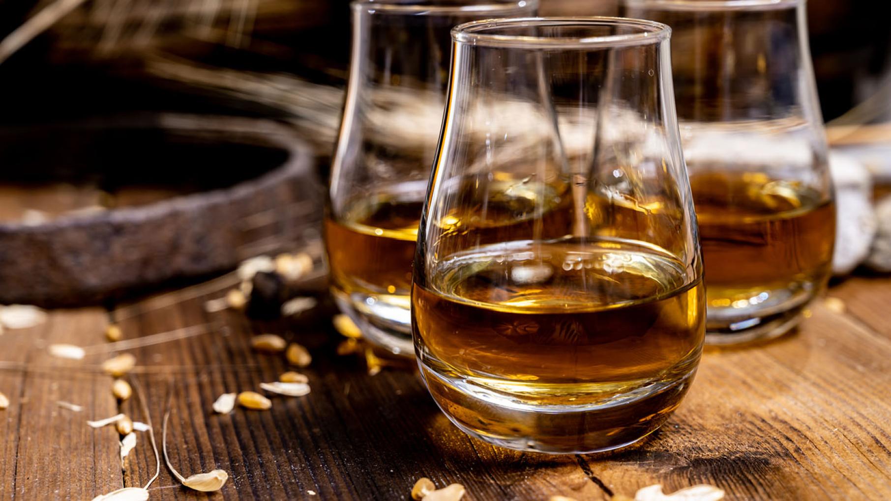 Koval Distillery's bourbon mash is comprised of corn and millet, giving it a Midwestern spin. Image: barmalini / iStock Three tasting glasses of bourbon.