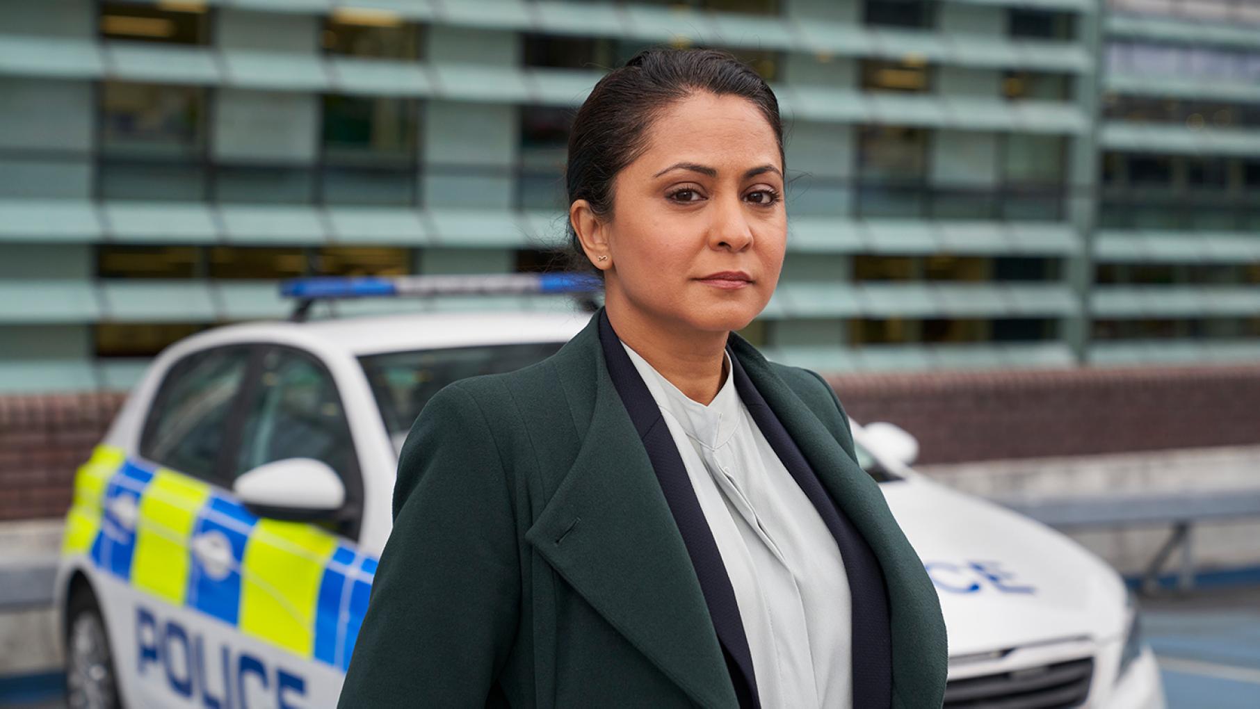 D.I. Rachita Ray quickly realizes that her promotion to Homicide is just to provide cover in terms of cultural sensitivity. Photo: HTM (DI Ray) D.I. Ray stands in front of a police car