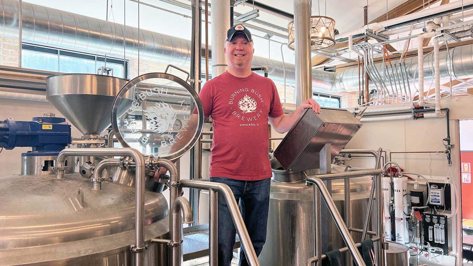 Brent Raska is the founder of Burning Bush Brewery. Image: Burning Bush Brewery Brent Raska at Burning Bush Brewery next to brewing vats