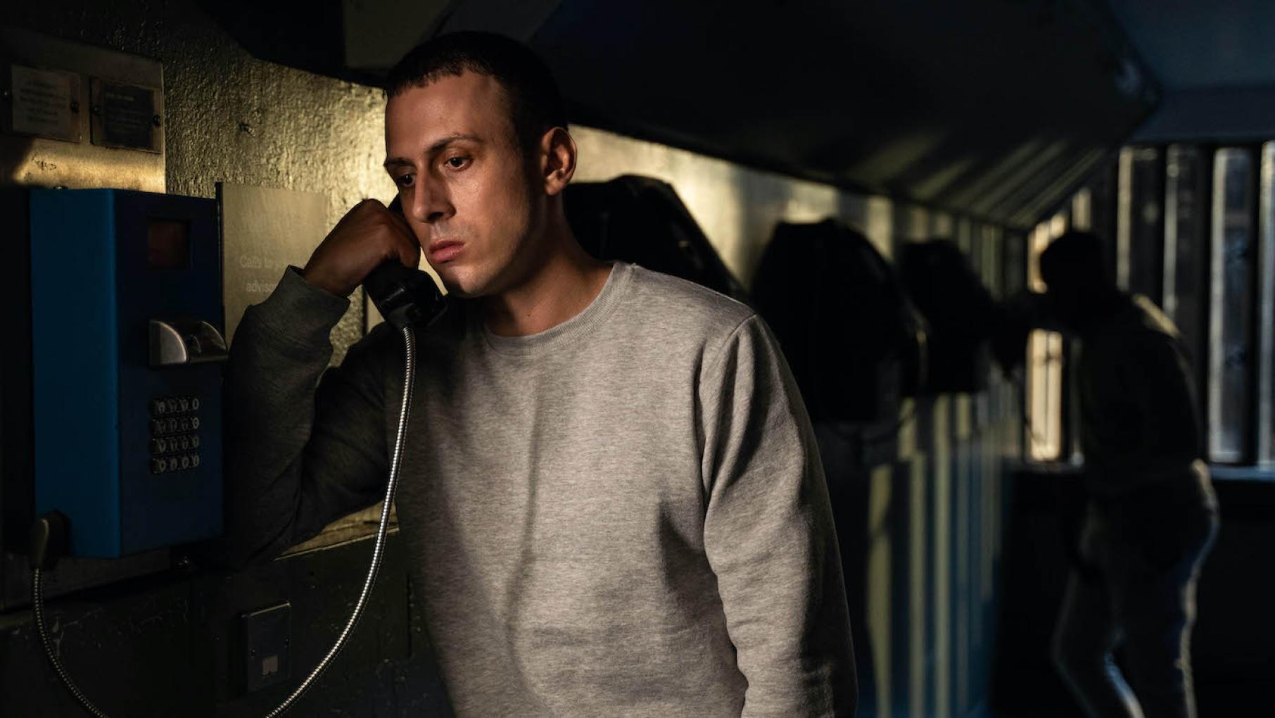 Jay makes a shocking claim about his family to the detectives. Credit: Mainstreet Productions Jay Royce stands in shadows on a phone in prison