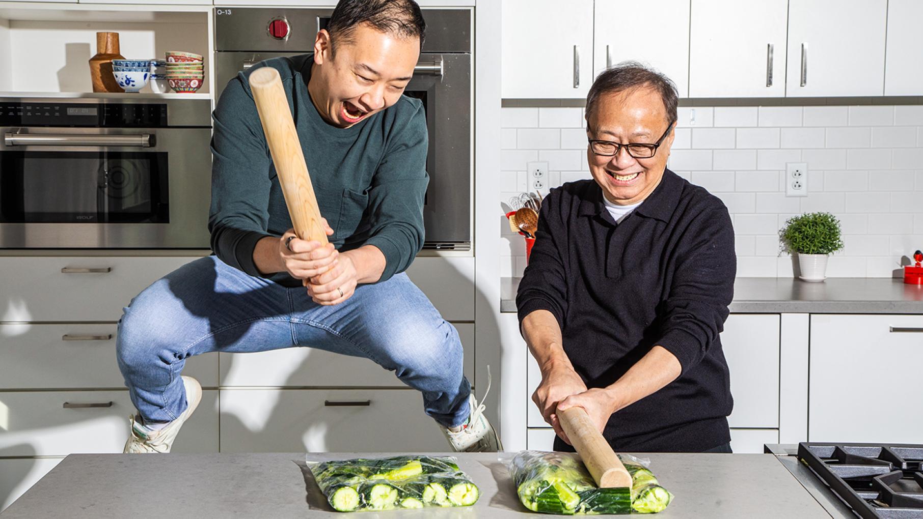 Kevin Pang and his father Jeffrey used to interact mainly via small talk or arguments. Now they have grown closer via food, and written a cookbook together. Credit: Kevin White for America's Test Kitchen Kevin Pang and his father gleefully smash cucumbers in a kitchen
