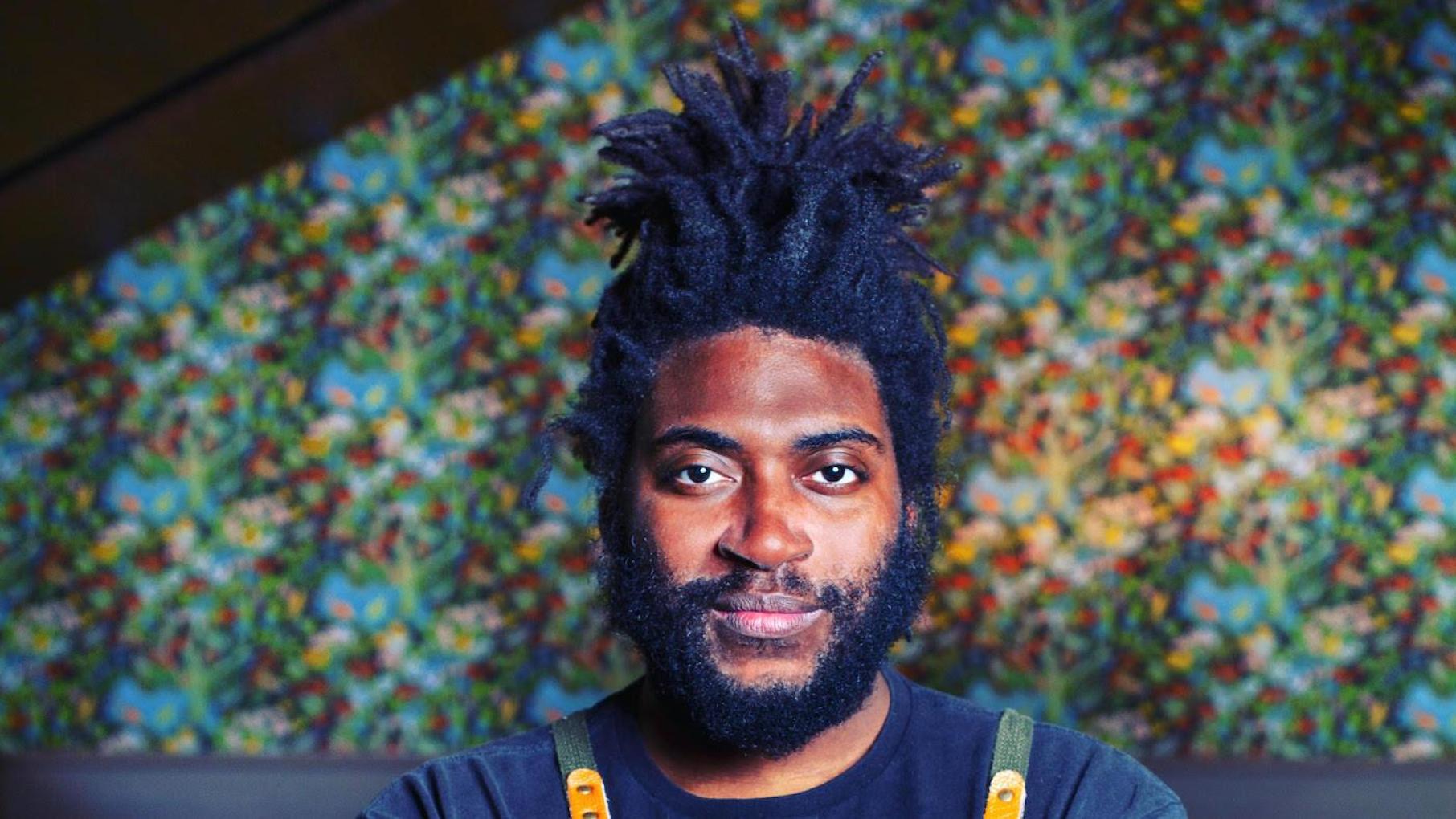 Christian Hunter of Atelier is a finalist for Rising Chef of the Year. Credit: Lauren Kinkade Christian Hunter against a colorful background