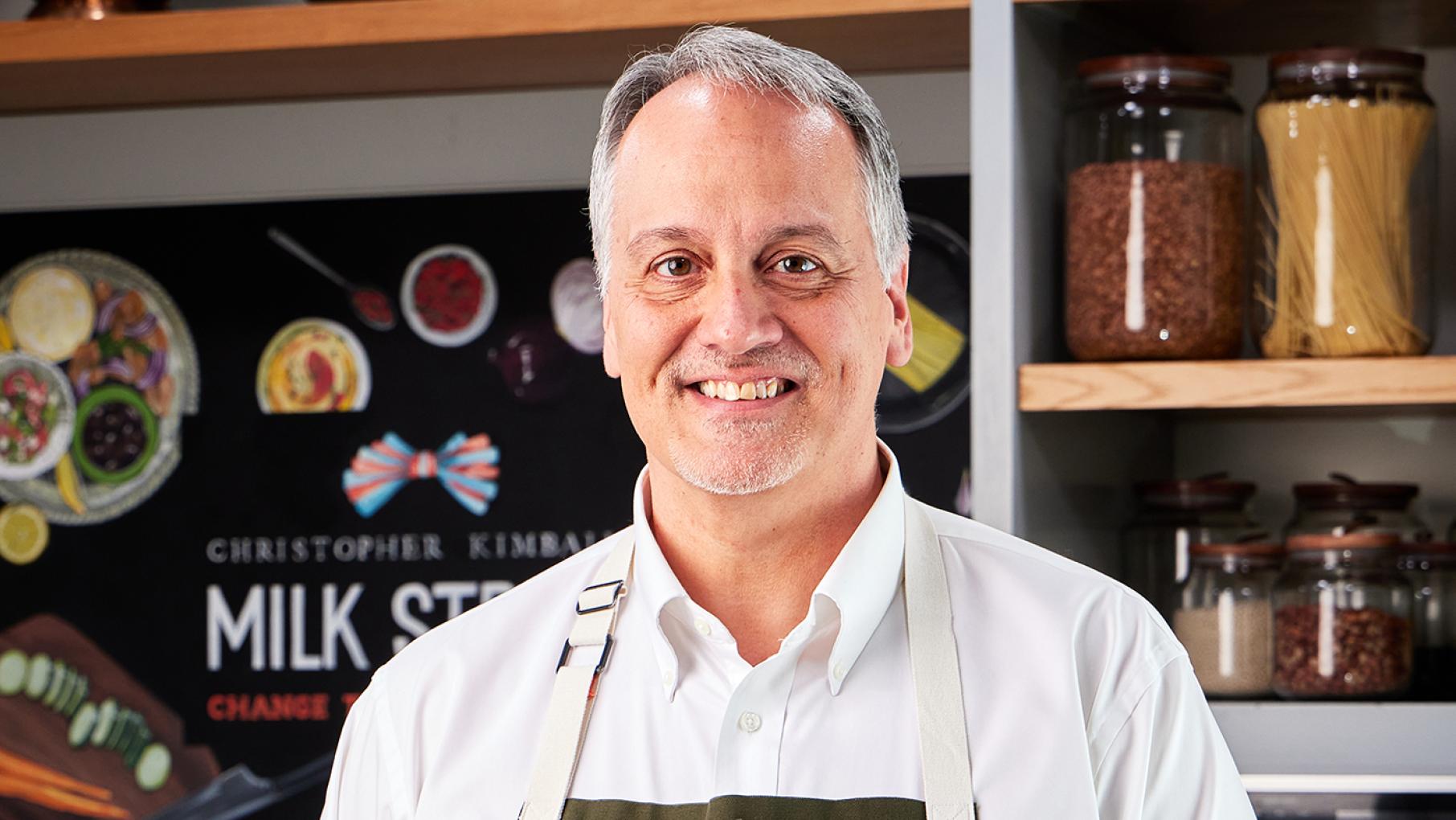 Thanksgiving is Wes Martin's favorite holiday, because “it is the one day that people stop, they sit at a table, and they talk to each other." Credit: Joe Murphy Wes Martin smiles in front of jars and a Milk Street sign