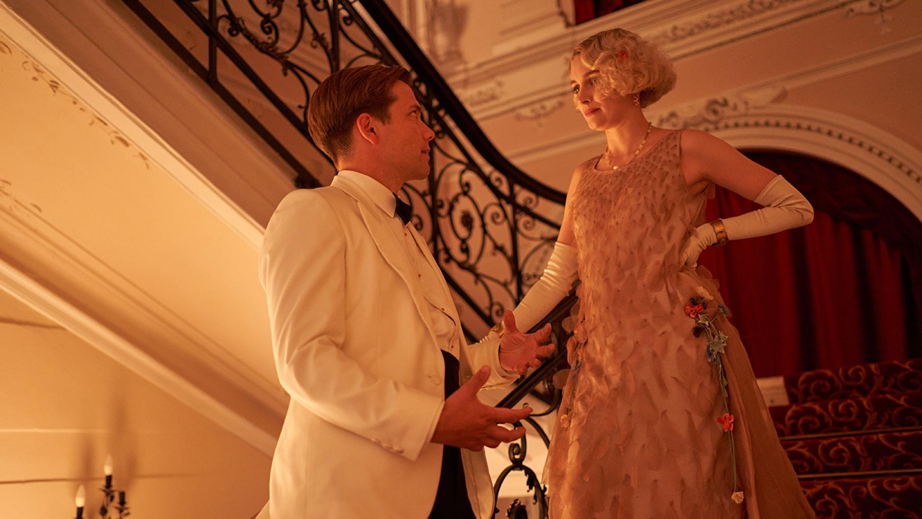 Rose finally gets Lucian to reveal his feelings. Credit: Eagle Eye Drama Lucian and Rose stand on a staircase in evening dress