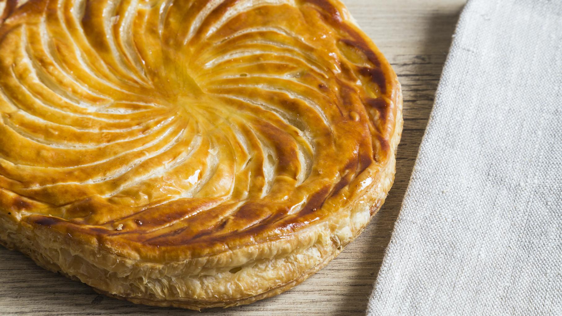 Galette des rois is the northern French version of what eventually became New Orleans' popular king cake A galette des rois next to a napkin on a table