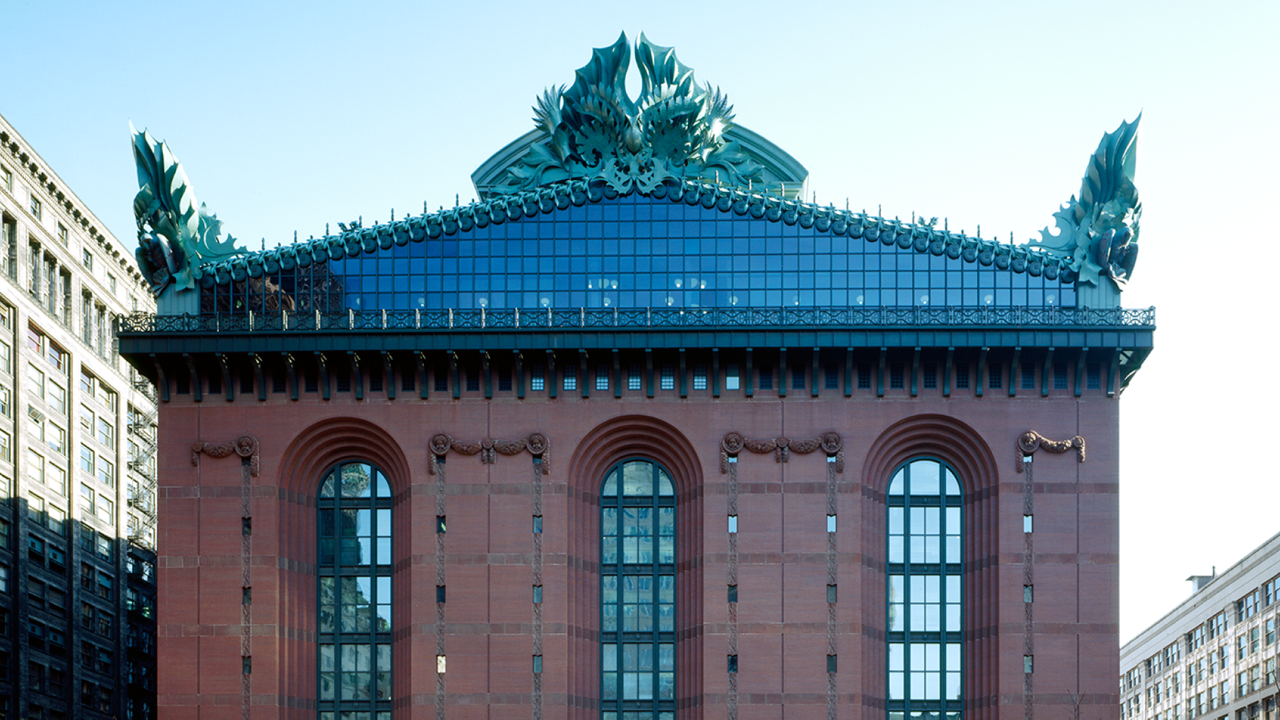 The Harold Washington Library is the main building of the Chicago Public Library. Credit: Wikimedia Commons/Carol M. Highsmith The red brick facade of the Harold Washington Library, with its glass gable and oversized ornaments