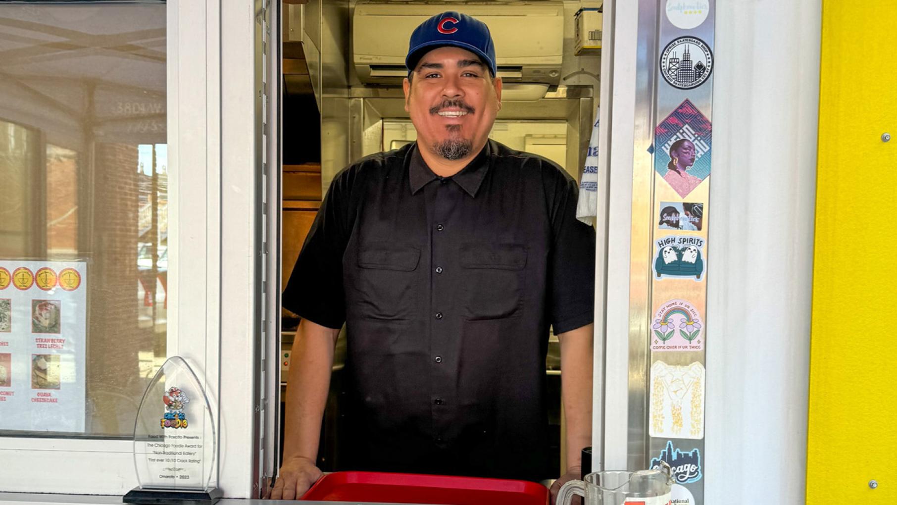 “The message I want people to receive is one of love, kindness, appreciation, and inclusivity to every f--king living person," says Omarcito's owner and chef Omar Cadena. Credit: Maggie Hennessy for WTTW Omar Cadena standing at the ordering window at Omarcito's