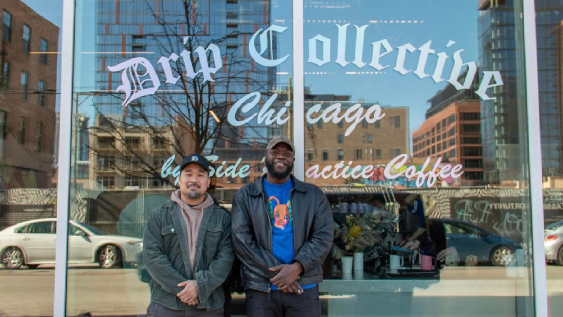 Francis Almeda and Ty Banks stand in front of their cafe, Drip Collective