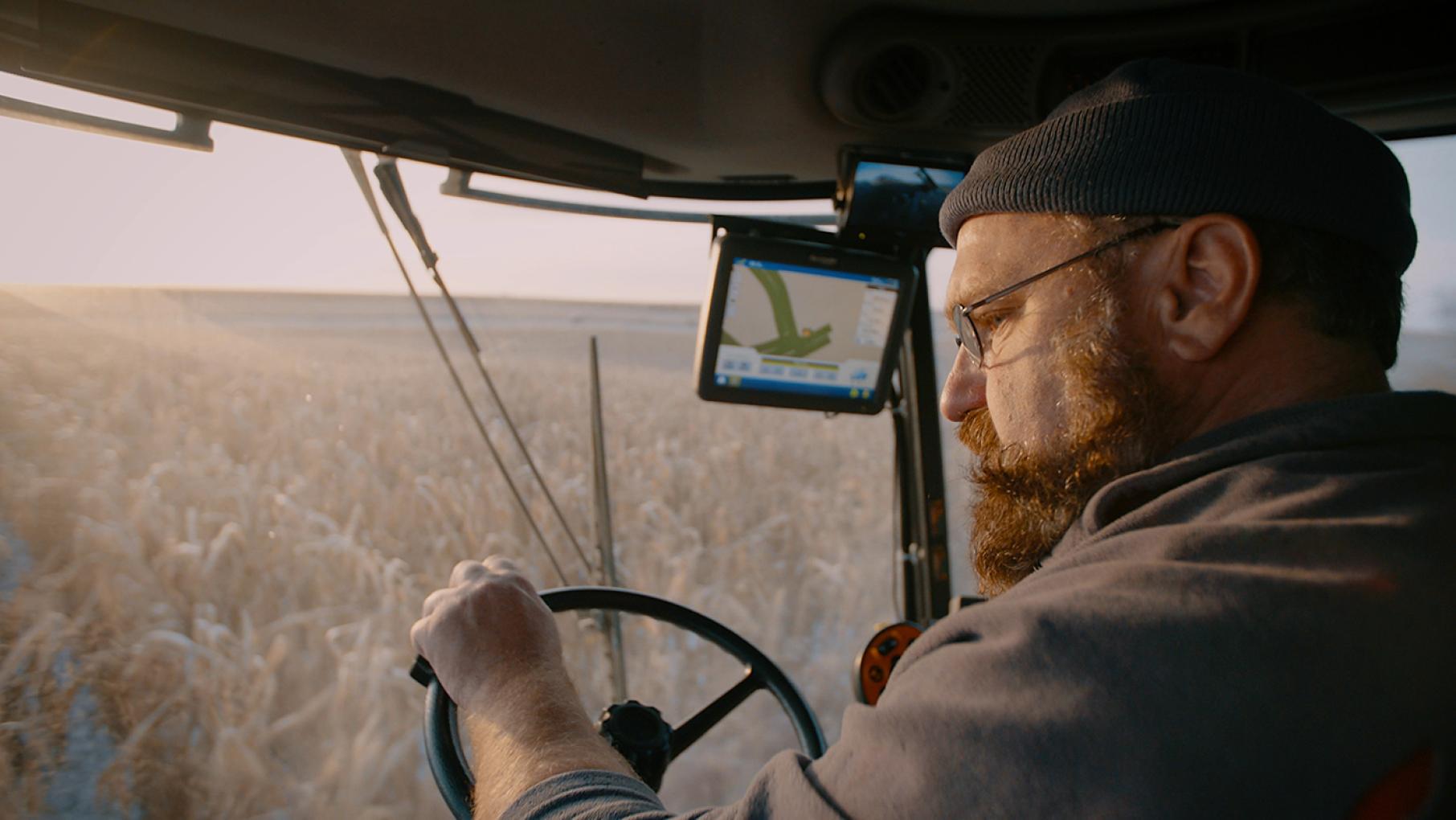 Jeff Ditzenberger is one of the subjects of 'Greener Pastures,' a documentary about the struggles farmers face and the mental health difficulties that often result. Credit: Samuel-Ali Mirpoorian Jeff Ditzenberger drives a piece of machinery through a farm field