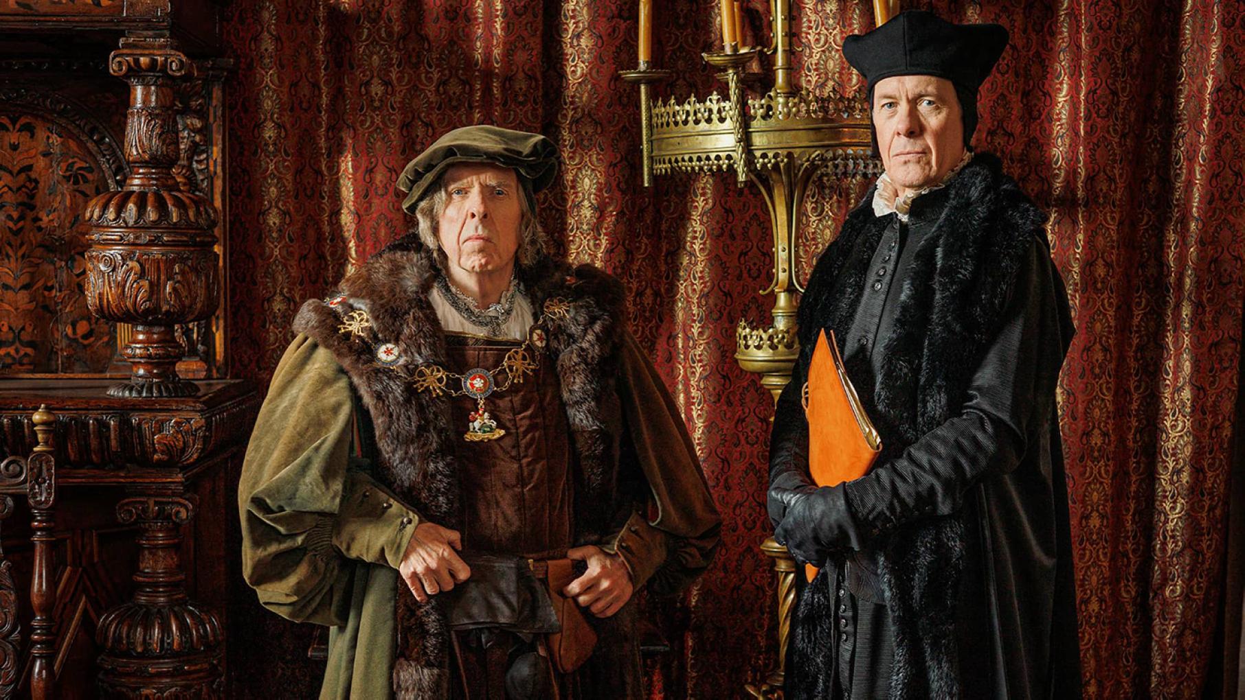 The Duke of Norfolk and Stephen Gardiner pose in front of ornate curtains and furniture