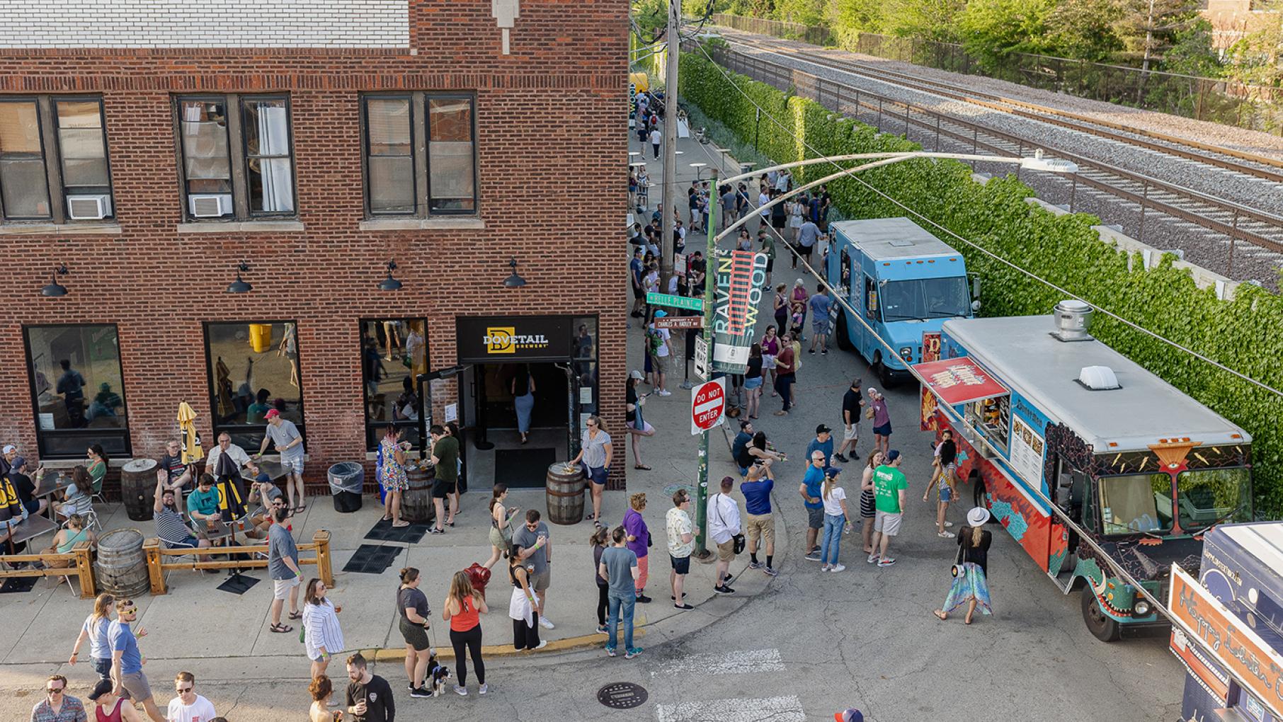 An aerial view of a crowd at a street festival