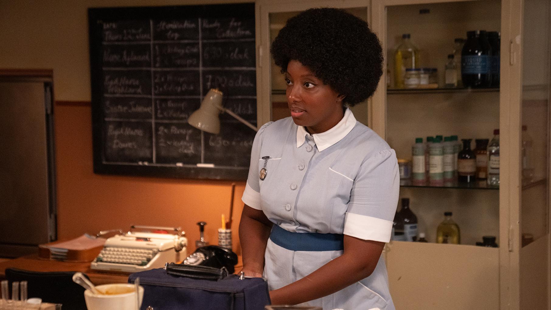 Joyce's past emerges to haunt her. Credit: BBC Studios/Neal Street Productions Joyce stands in a nurse's outfit