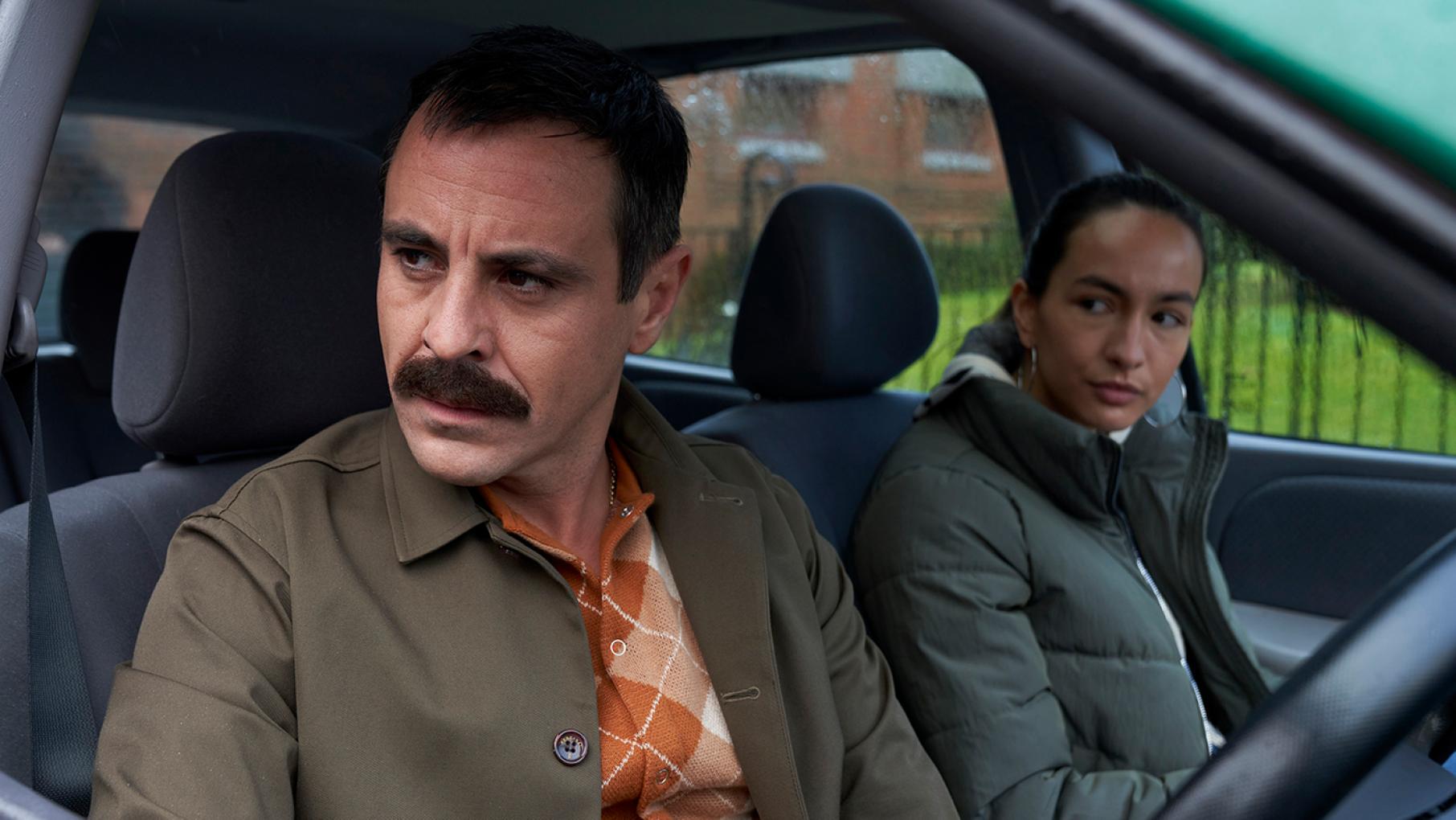 Kenny decides to find the McCalls so they can help him and his niece, Skye. Credit: Expectation, Happy Tramp North, BBC, and Masterpiece Kenny and Skye sit in a car and look out the open window