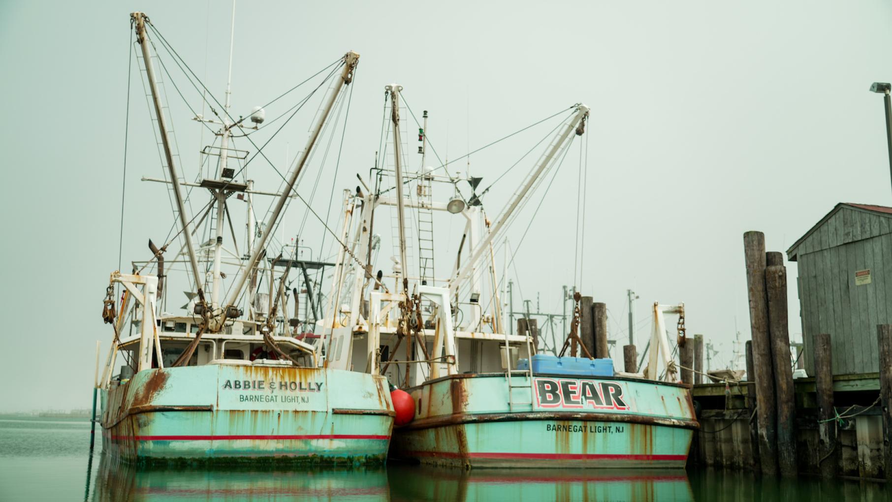 Fishing boats in Barnegat Light, NJ in 'Hope in the Water.' Credit: Sam Johnson Two fishing boats sit near a dock