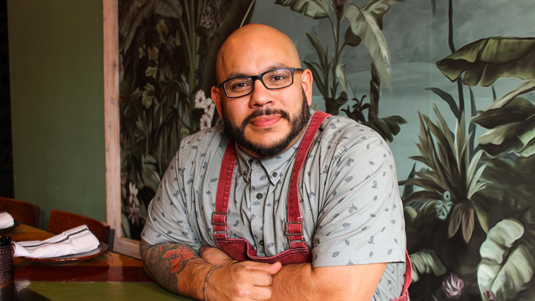 The James Beard Award-recognized chef Rodolfo Cuadros is opening a cocktail lounge themed around '90s nostalgia with his business partners. Credit: Kinship Chef Rodolfo Cuadros poses for a portrait