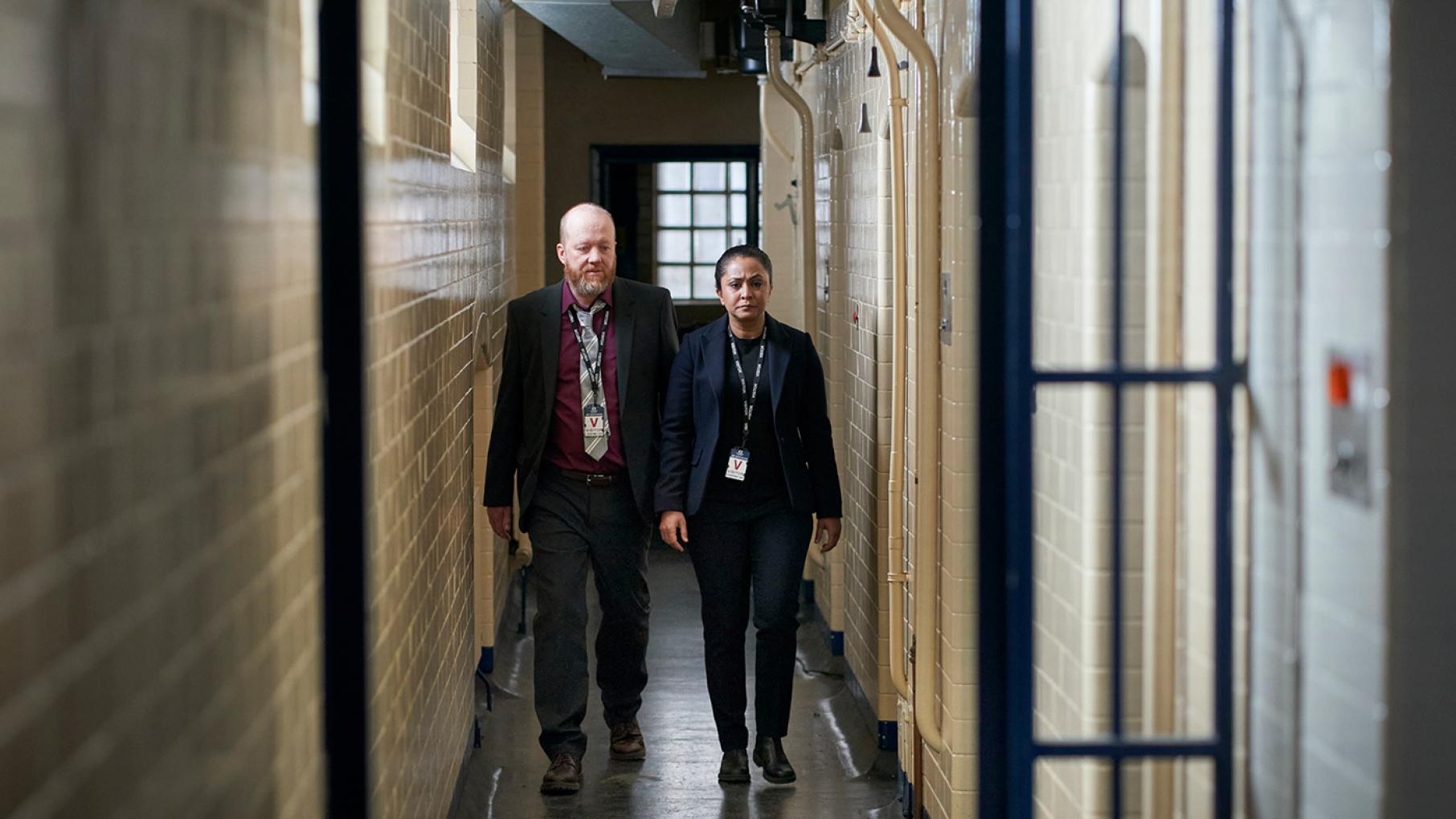 D.I. Ray and Clive visit a figure from Ray's past who has information on her case. Credit: Hat Trick Media DI Ray and Clive walk down a narrow hallway