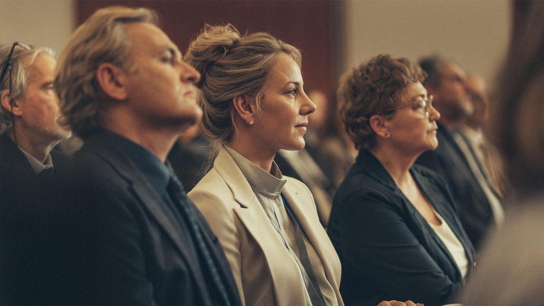 Alex and Tina Morley sit next to each other in a row in an audience