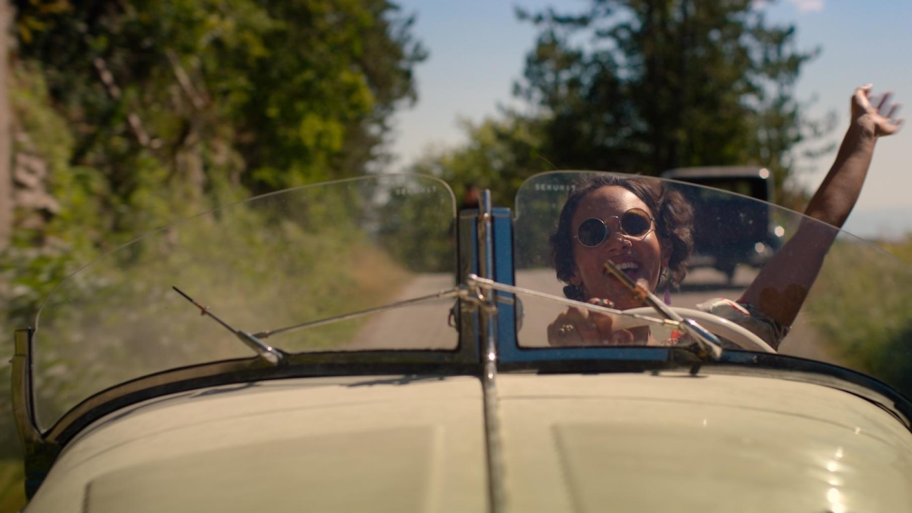 Claudine is renting out the hotel to launch her perfume. Credit: Eagle Eye Drama Claudine Pascal waves while driving a convertible
