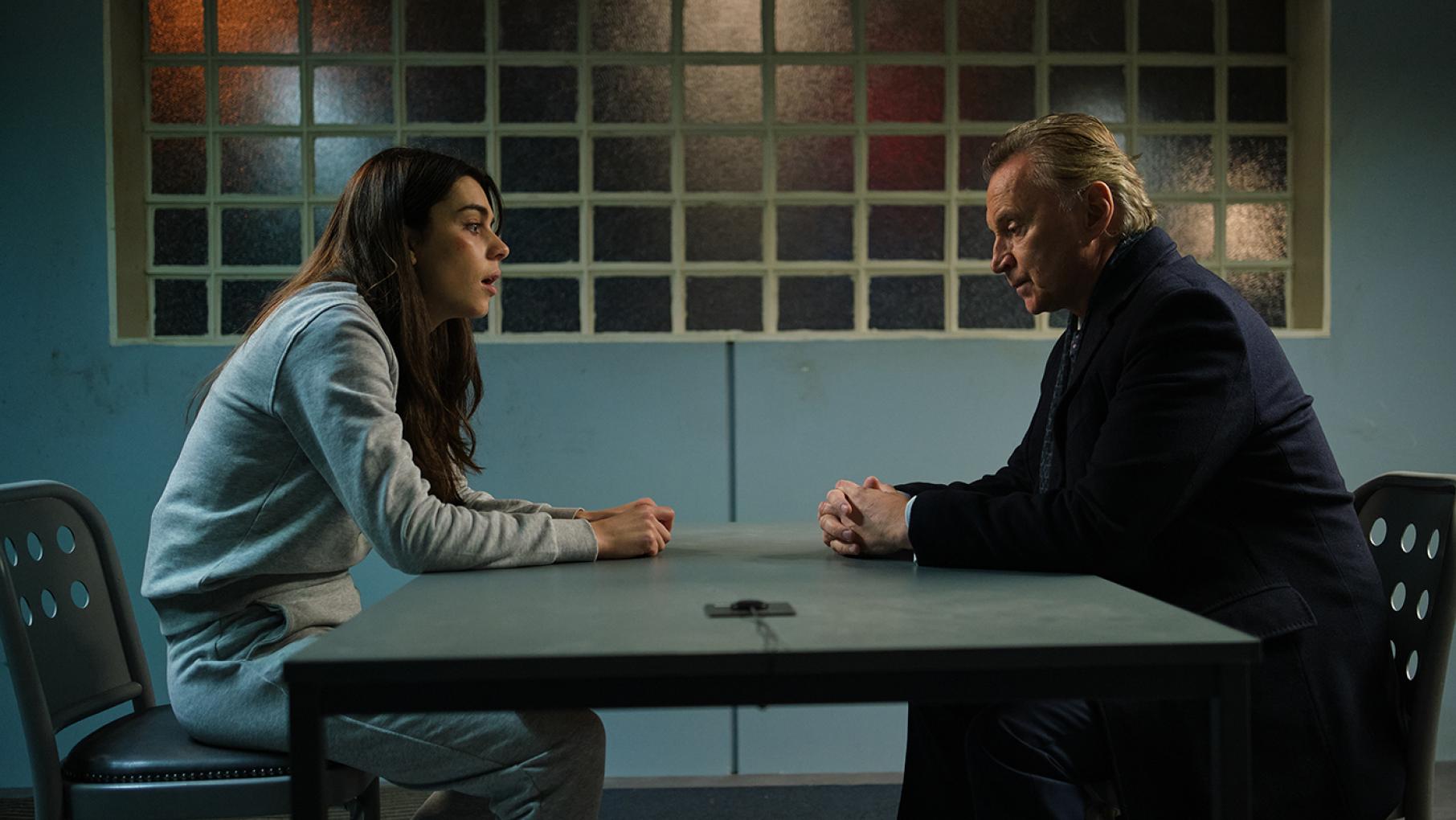 Robert clashes with Ellie while she is in custody. Credit: Sky Studios Limited Ellie sits across a table in prison from Robert