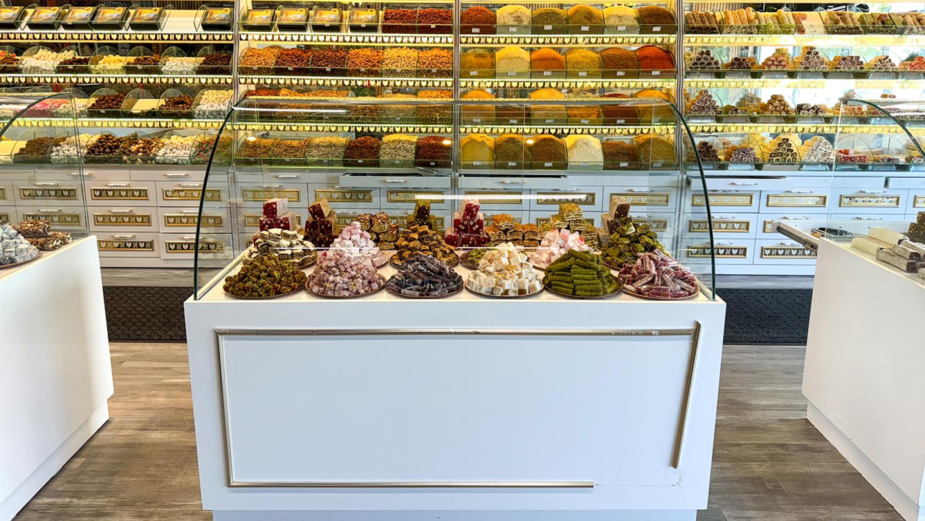 Yakup Bey Turkish Delight is just one of several new globetrotting culinary businesses in the Northwest Side neighborhood of Dunning. Credit: Maggie Hennessy for WTTW Turkish delights, other candies, spices, and nuts on display in rows and on platters