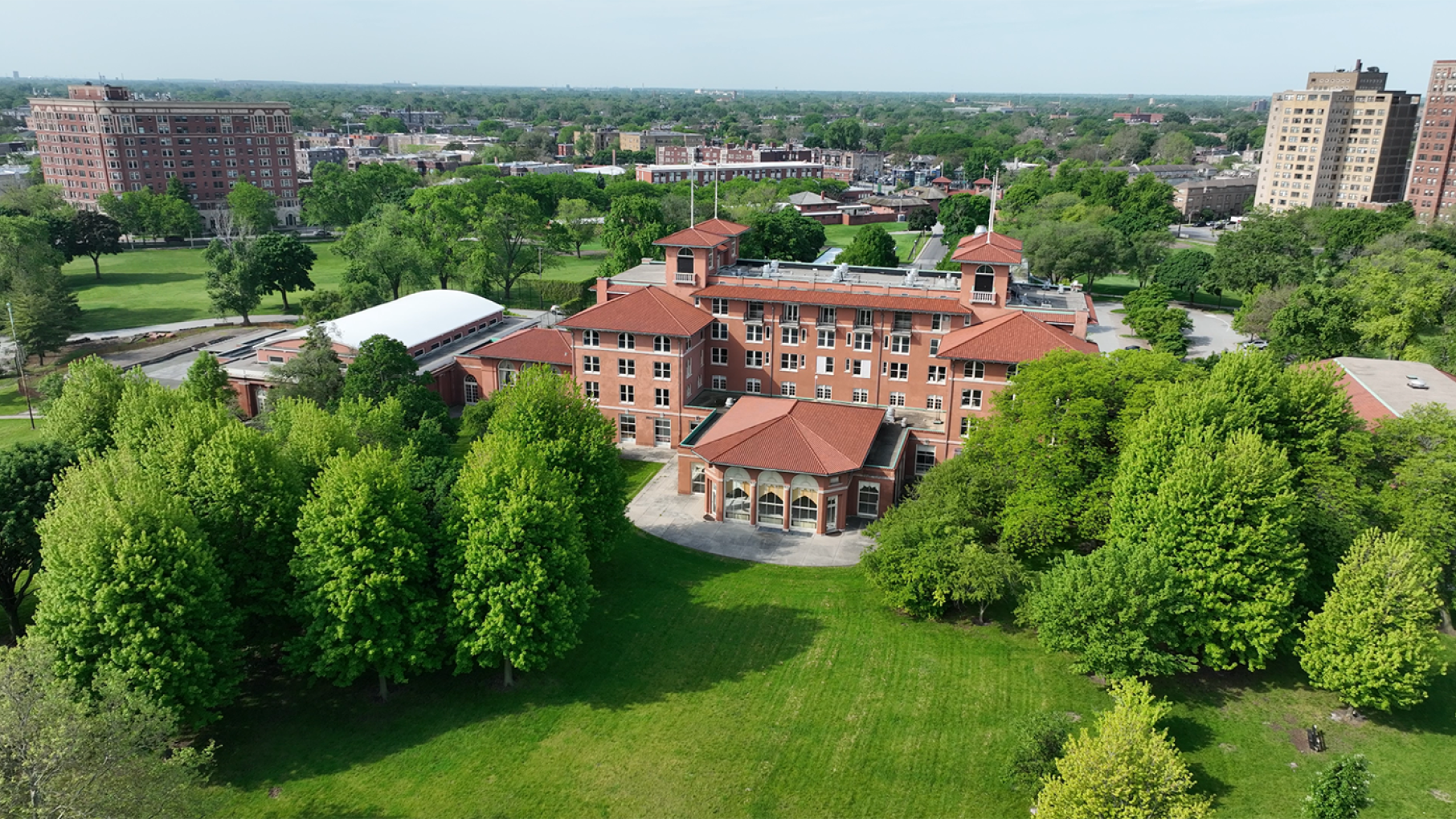 The South Shore Cultural Center was once a country club that excluded Black people. Now it's home to a Black-owned soul food restaurant. Credit: Justin Henderson for WTTW The South Shore Cultural Center seen from above amid grass and trees