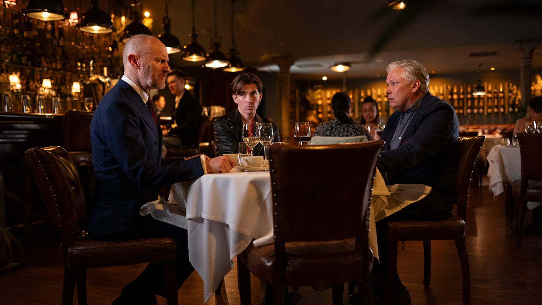 Alan Conway knew Frank Parris, whose murder inspired one of Alan's novels, as Susan finds out. Credit: Jonathan Hession for Eleventh Hour Films and Masterpiece Frank Parris sits at a table in a restaurant with James Taylor and Alan Conway