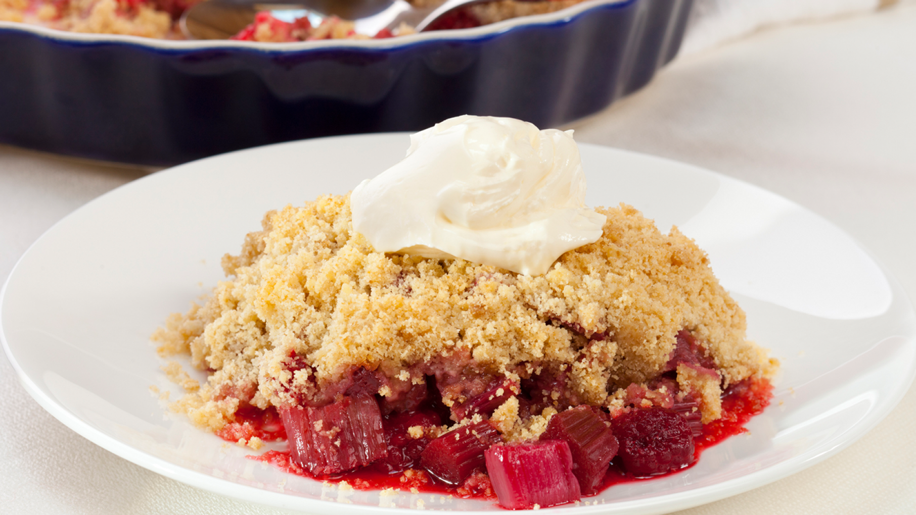 Rhubarb Crumble A rhubarb crumble on a plate with ice cream