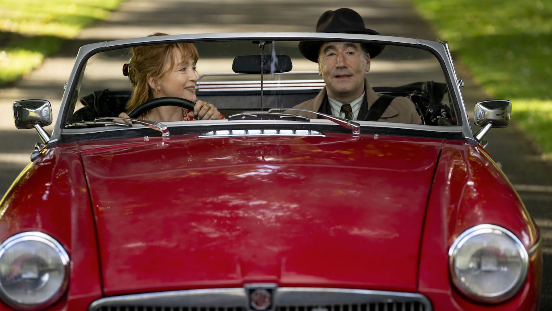 Susan and Atticus have solved their mysteries. Credit: Masterpiece Susan and Atticus in her red convertible