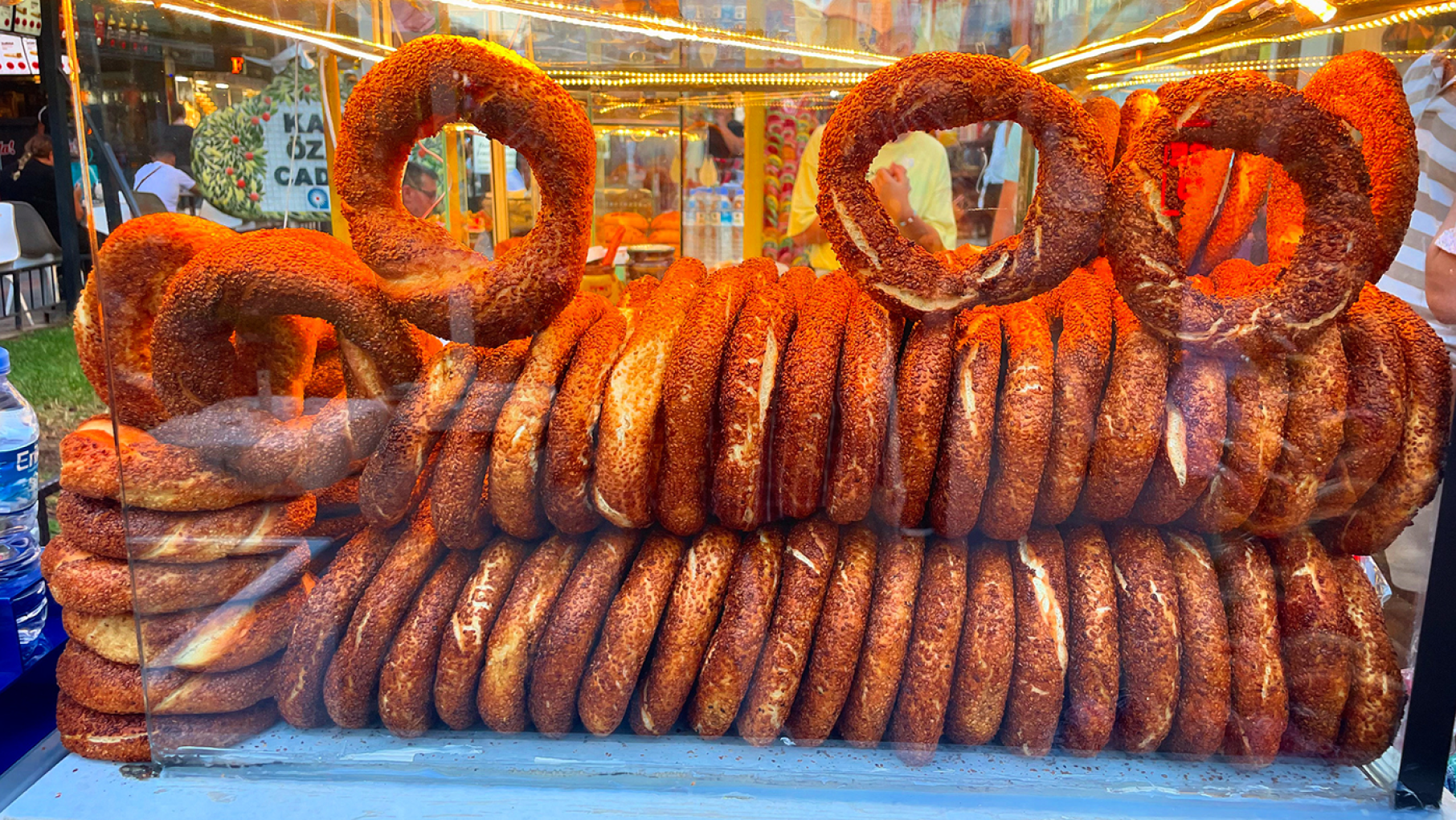 The bagel-like bread known as simit is an instant comfort food found at stands and breakfast spreads across Turkey. Credit: David Hammond for WTTW Turkish simit, circles of dough like a bagel, on display