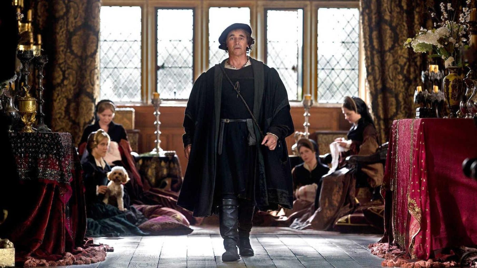 Thomas Cromwell marches away from ladies sitting together