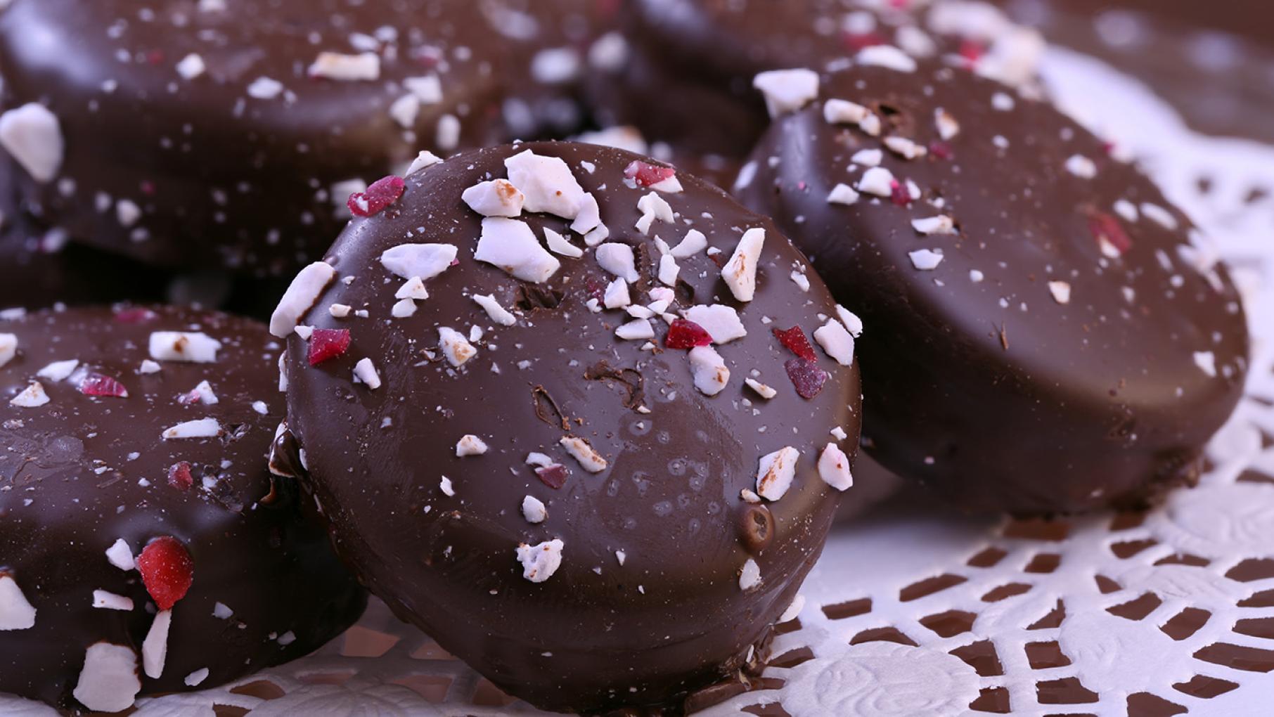 Credit: iStock Chocolate coated cookies topped with peppermint crumbles