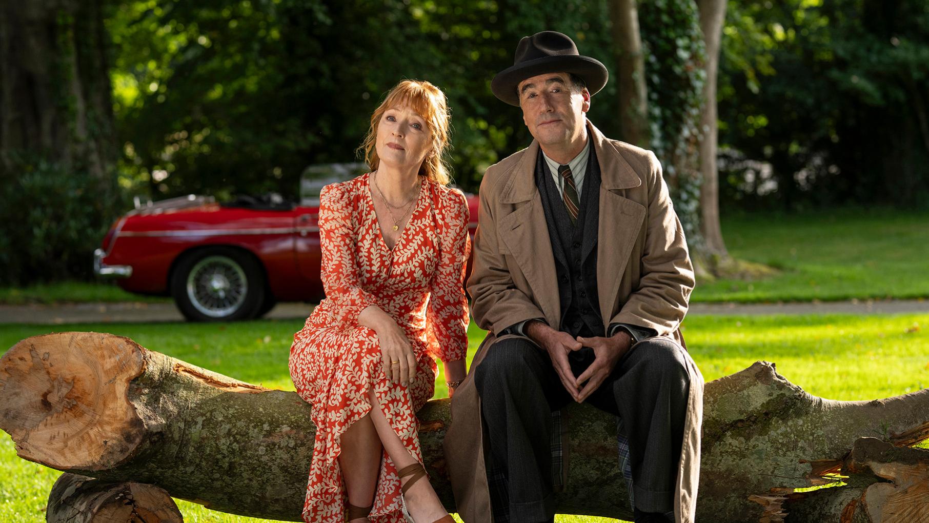 Susan Ryeland and Atticus Pünd are returning for one last mystery in Marble Hall Murders. Credit: Masterpiece Susan Ryeland sits next to Atticus Pund