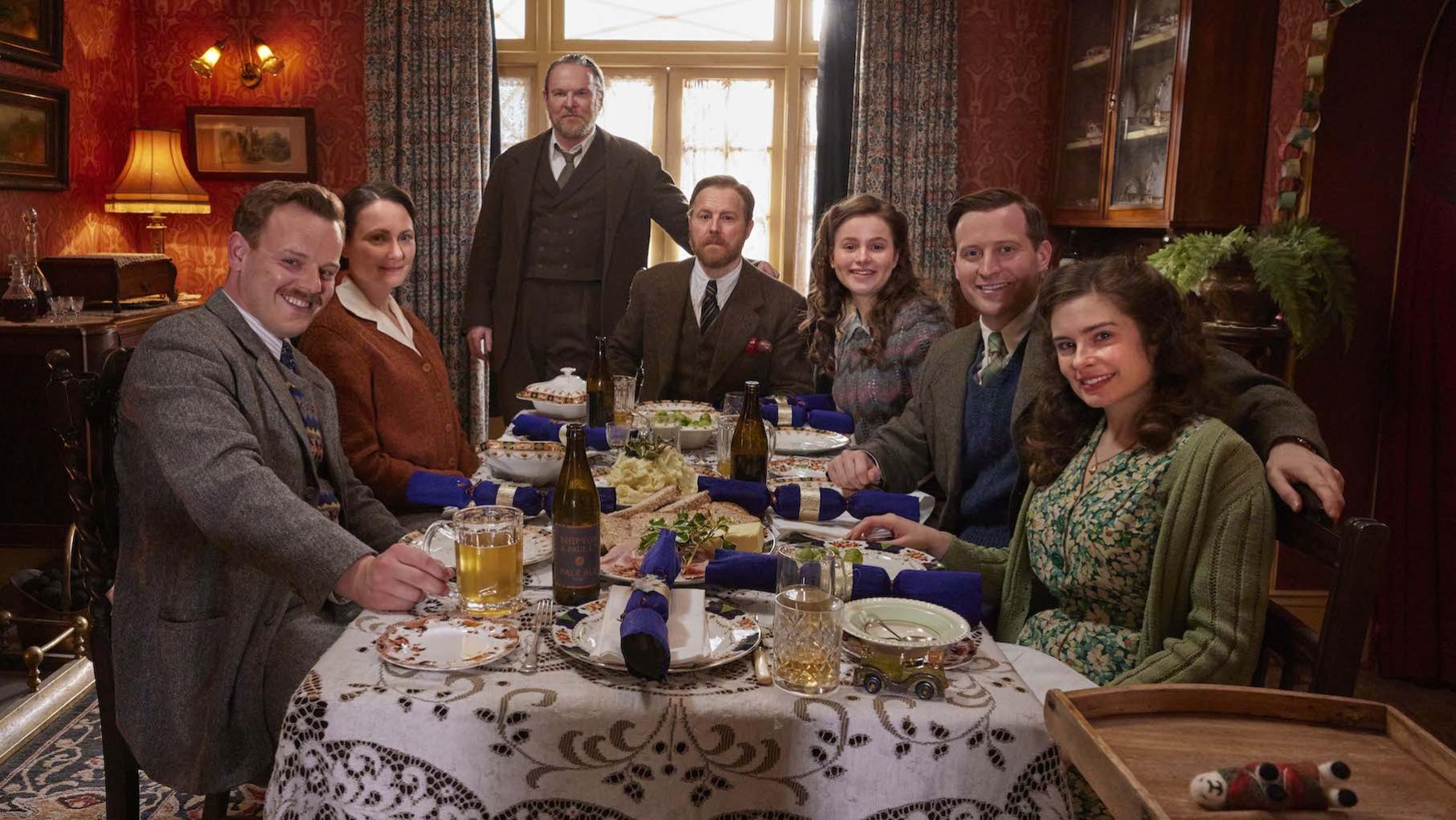 Christmas and Jimmy's first birthday are shadowed by the war. Credit: Playground Entertainment and Masterpiece The cast of All Creatures Great and Small smile around a table