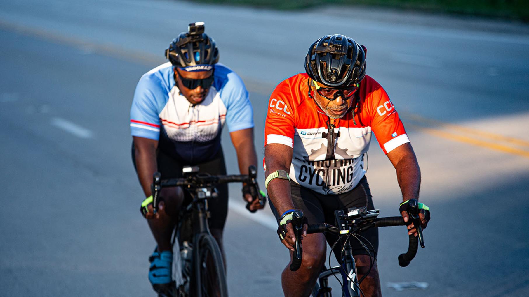 Eric D. Seals and his father, Donnie Seals, Sr. on day three of their bike ride from St. Louis to Chicago. Credit: Timothy M. Schmidt / Bike Vessel, Independent Lens Eric D. Seals and his father Donnie Seals, Sr. riding on bicycles