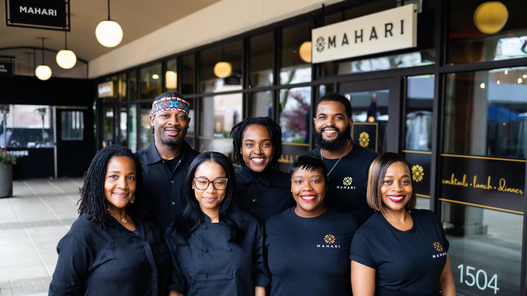 Chef Rahim Muhammad (top left), partner Magic Johnson (top right), and beverage director Lisa Brown (bottom right) celebrate the African diaspora at the new Hyde Park restaurant Mahari. Credit: Mahari The staff of the restaurant Mahari stand outside their restaurant and smile in black t-shirts