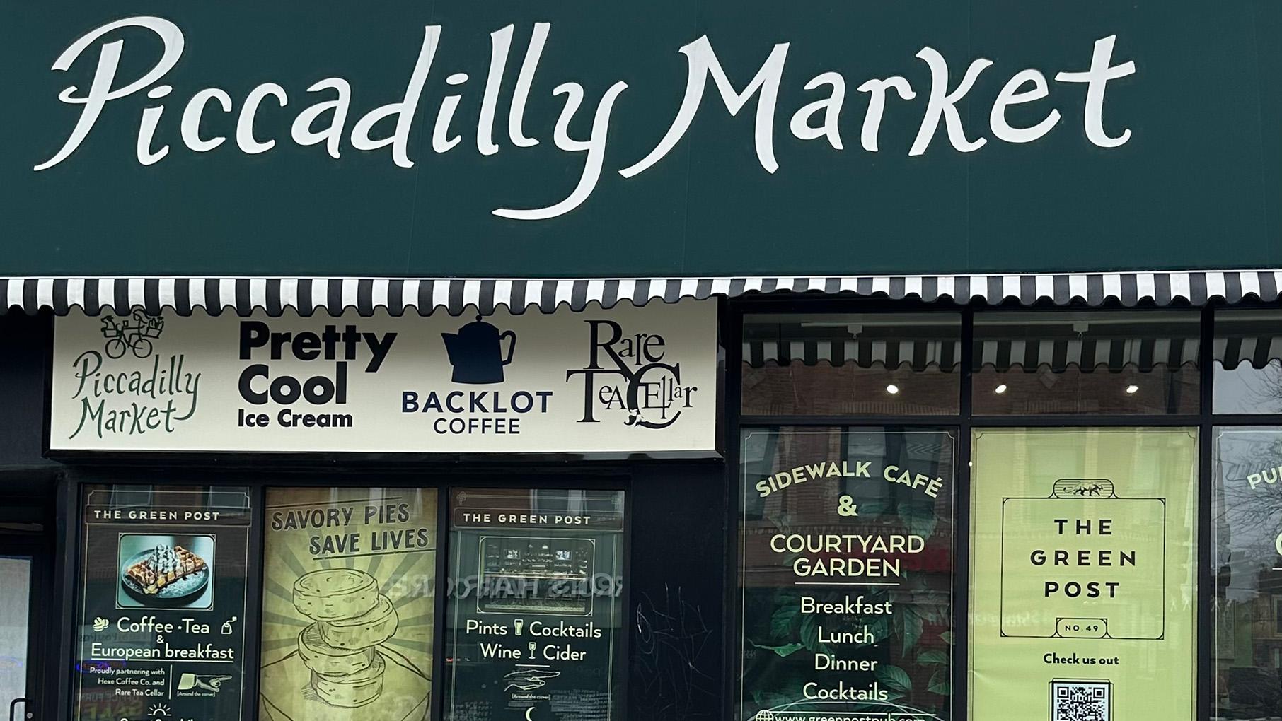 The awning and exterior of a corner stores called Piccadilly Market