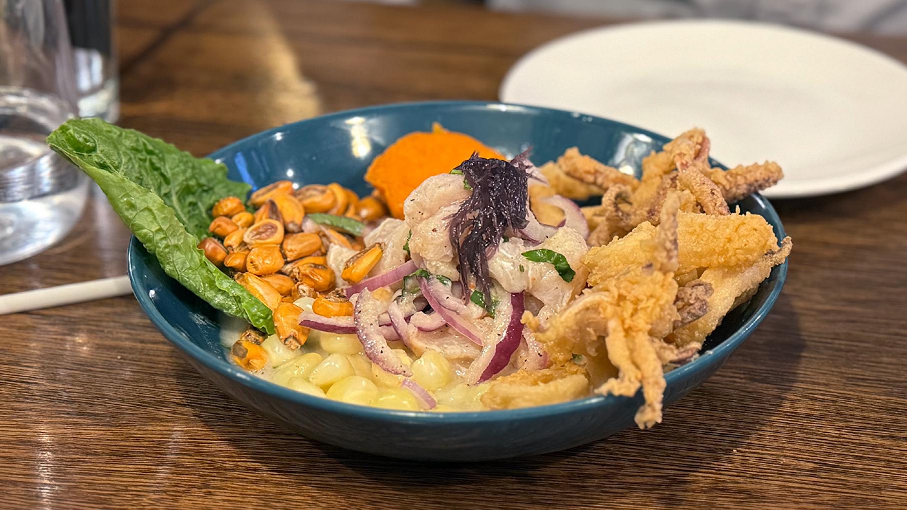 Ceviche carretillero from Avenida Peru in Belmont Cragin. Credit: Maggie Hennessy for WTTW Ceviche carretillero in a blue bowl from Avenida Peru