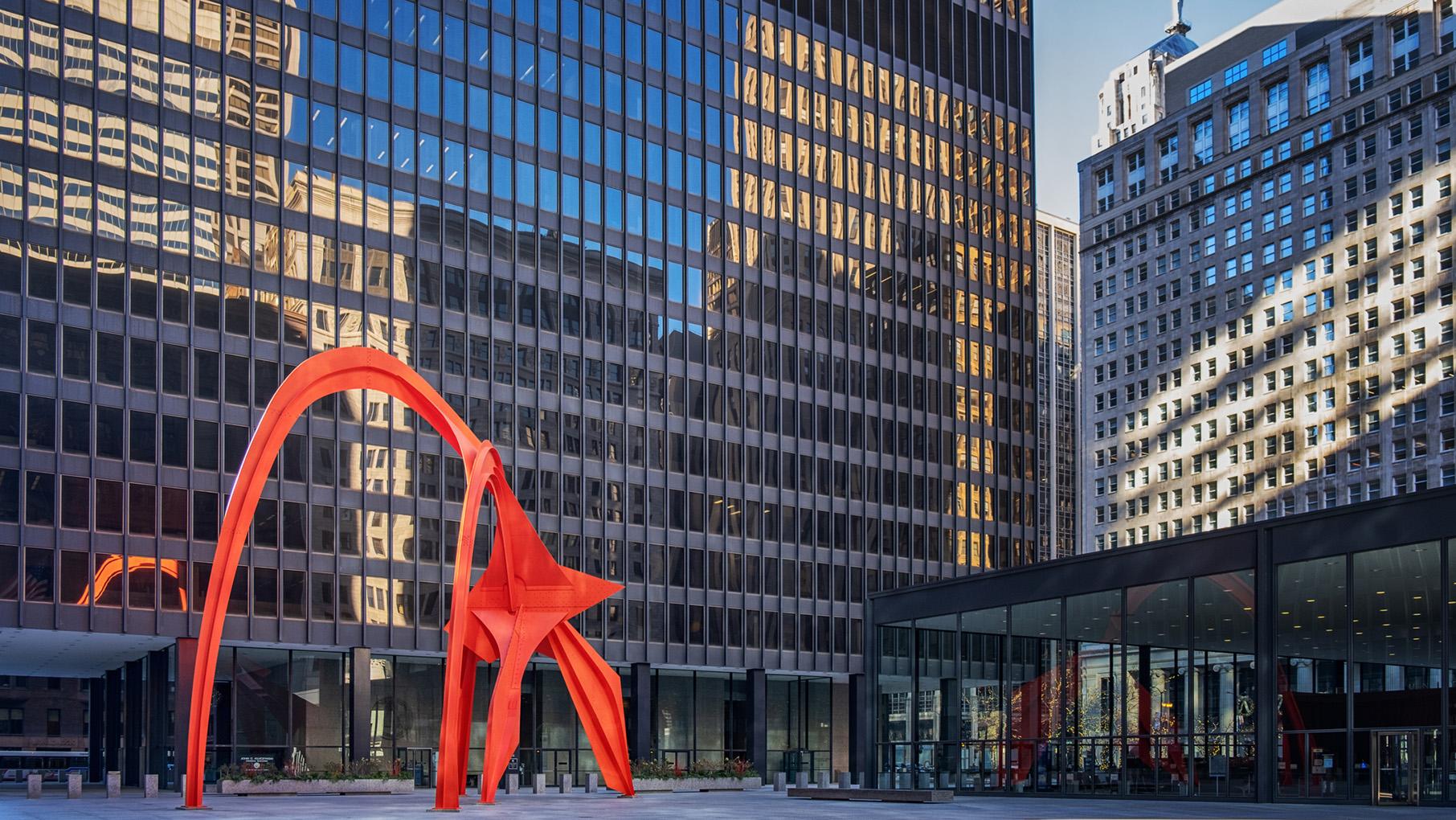 Chicago's Federal Center was designed by the influential architect Mies van der Rohe and contains a sculpture by Alexander Calder. Credit: iStock Alexander Calder's red Flamingo sculpture in Chicago's federal plaza