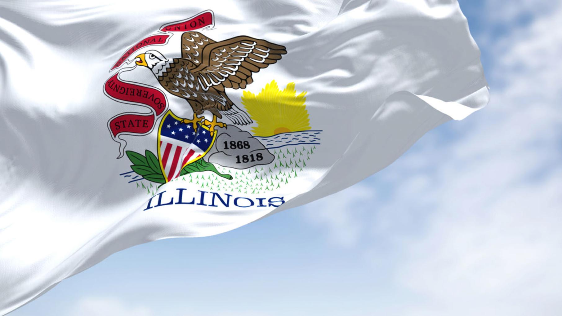 Credit: rarrarorro / iStock The Illinois state flag waves in a breeze against a partly cloudy, blue sky