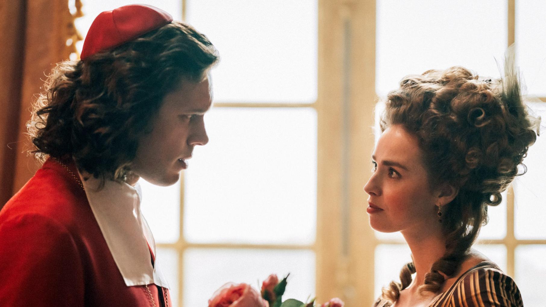 Cardinal Rohan looks at Jeanne in front of a window