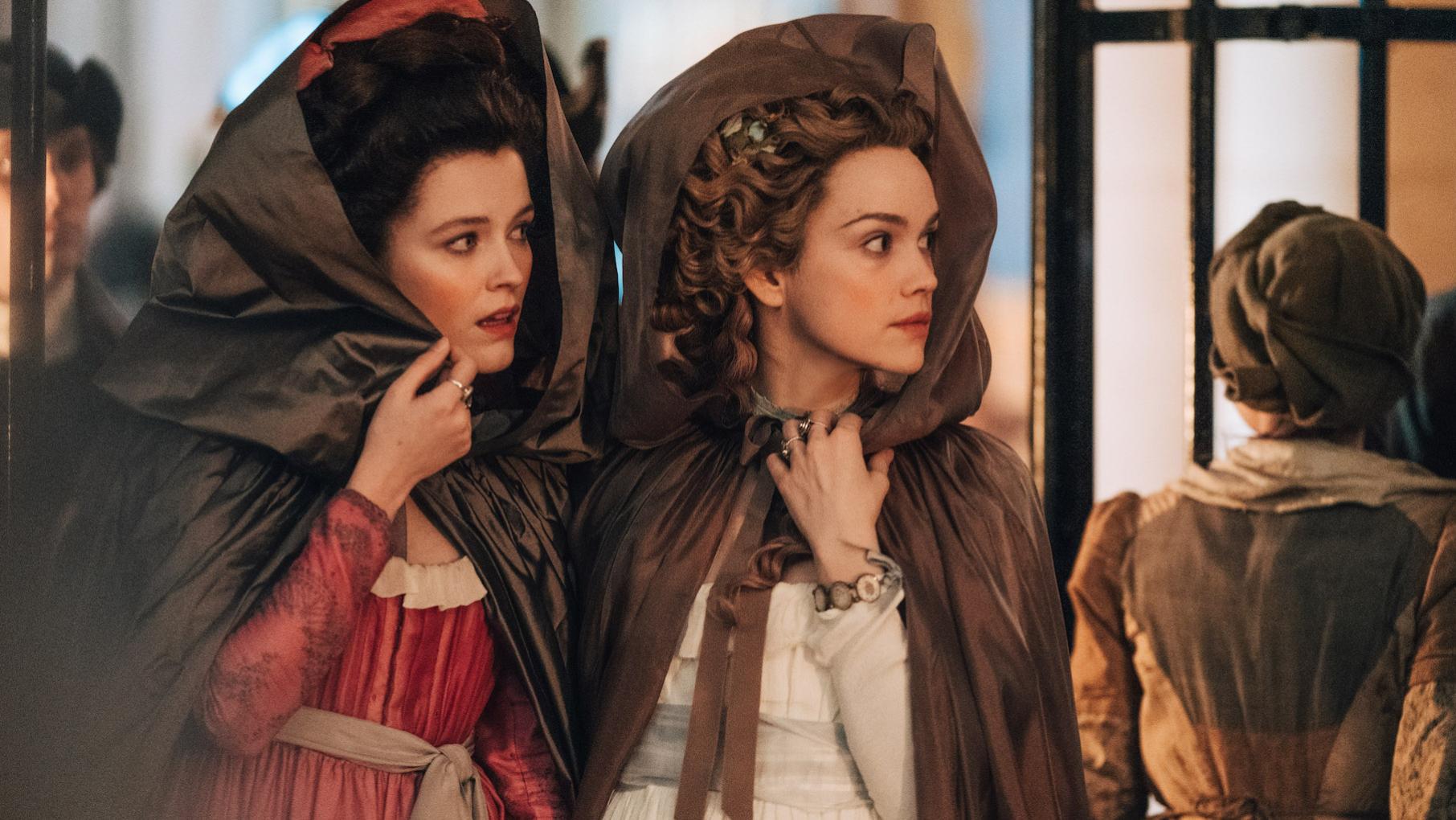 Antoinette goes undercover to see the public's real opinion of her. Credit: Caroline DuBois for Capa Drama and Canal Plus Yolande and Antoinette under capacious hoods