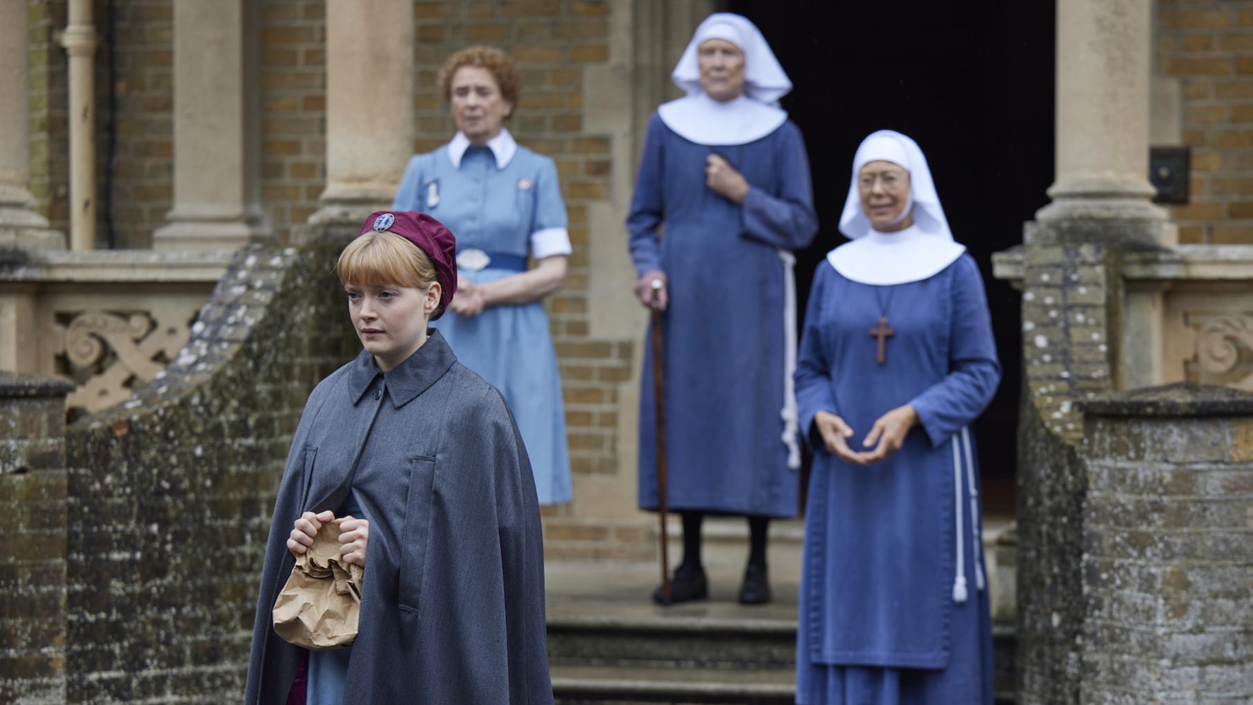 The nurses end up caring for a baby that is given up by her parents when they learn she has spina bifida. Credit: BBC Studios The midwives stand on the steps of Nonnatus House
