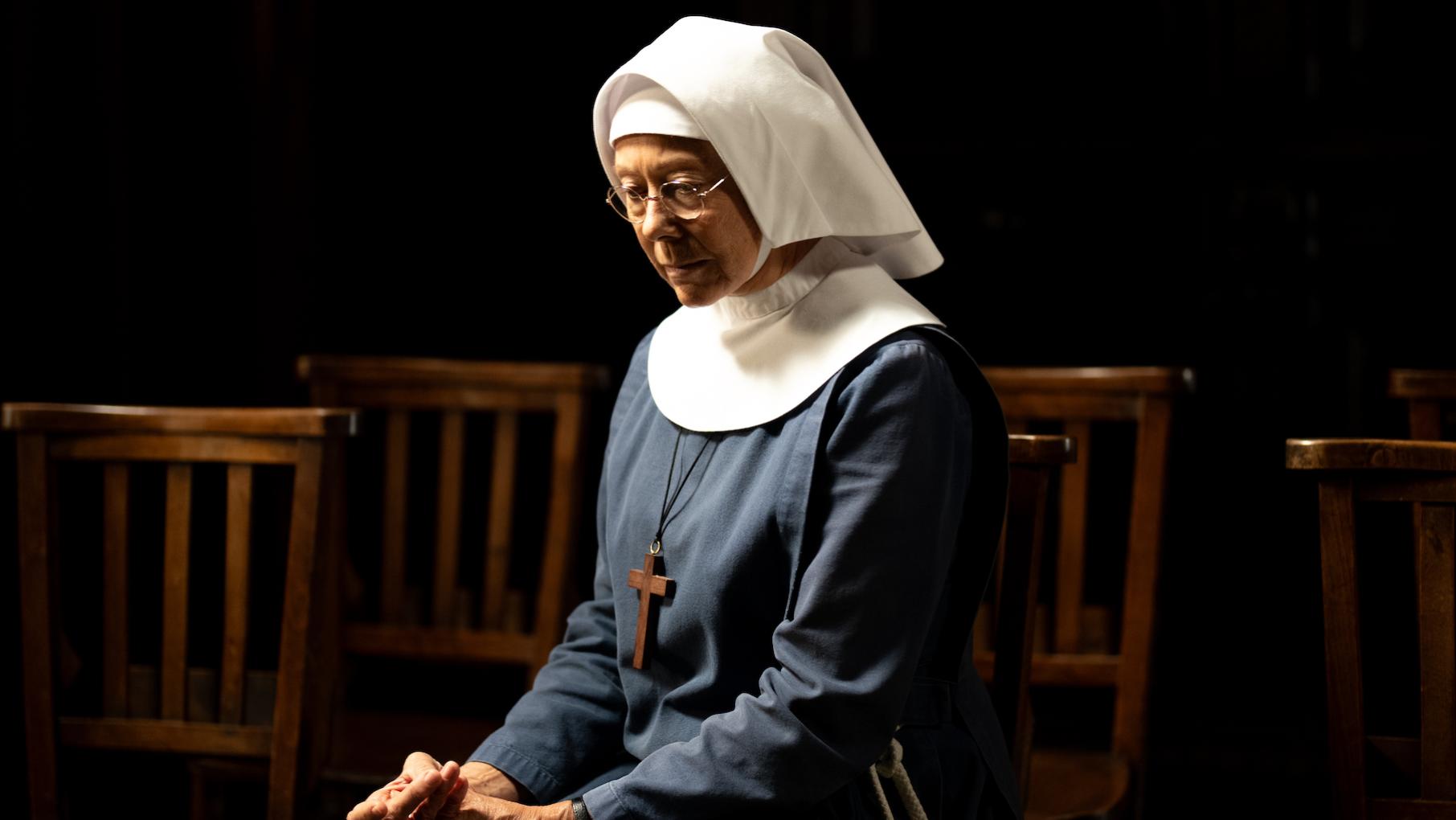 Sister Julienne wonders if she is actually doing any good as she tries to help a woman with an abusive husband. Credit: BBC Studios Sister Julienne sits looking contemplative in the dark