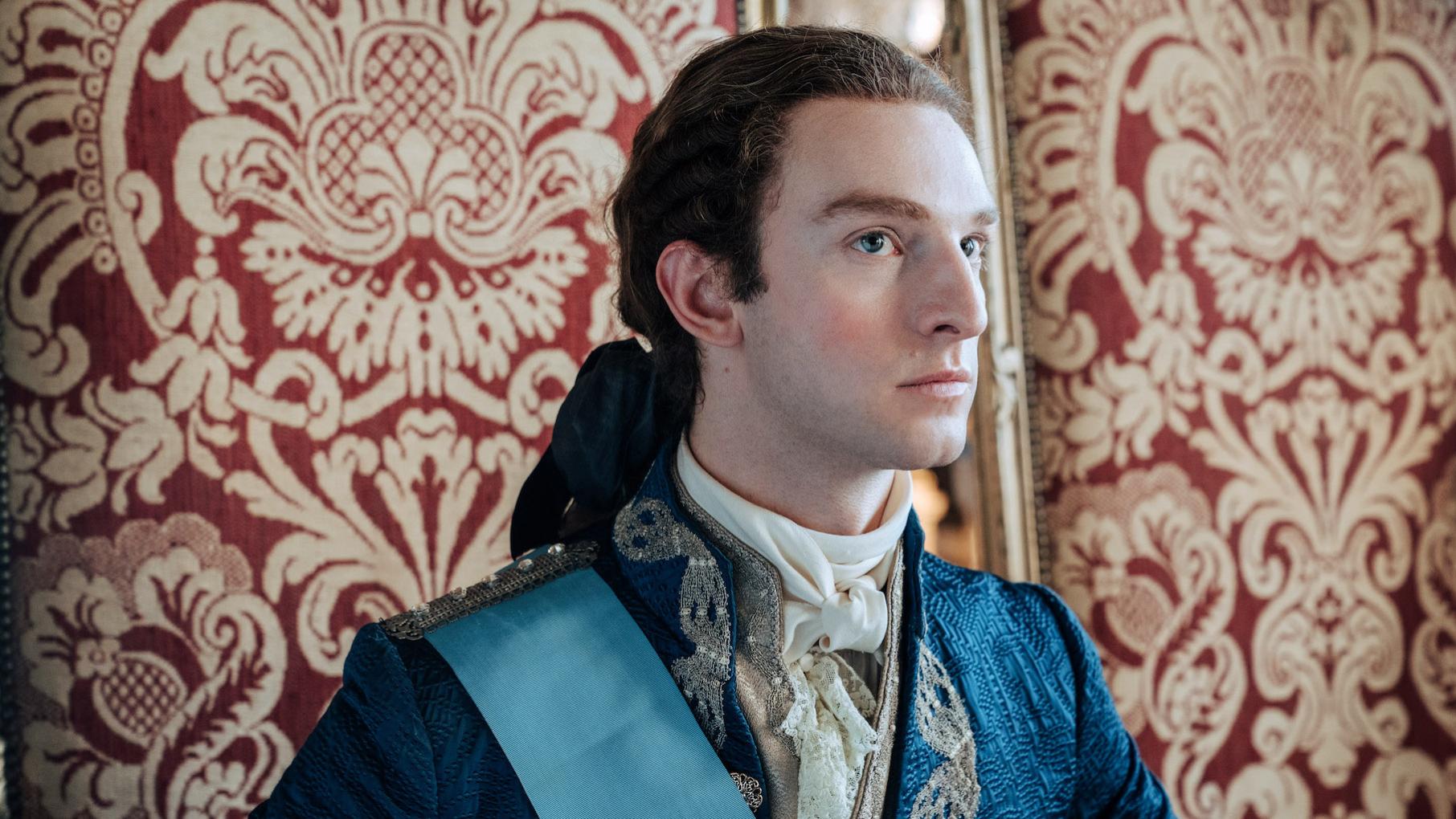 Louis' reign grows ever more threatened and unpopular. Credit: Caroline Dubois for Capa Drama and Canal Plus Louis sits in front of an ornate pattern