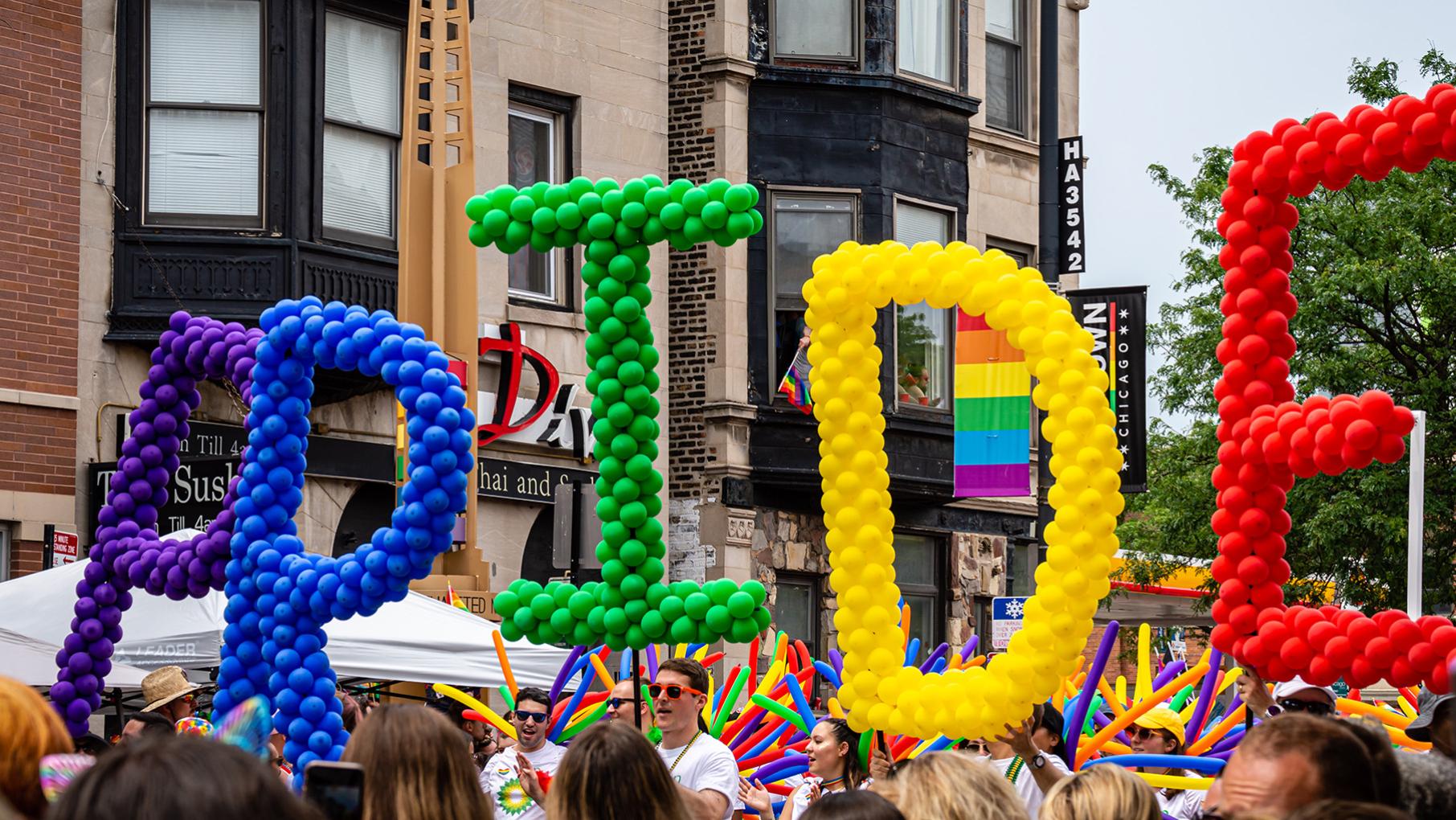 Credit: Antwon McMullen / iStock Balloon letters spelling "PRIDE" in rainbow colors at the Chicago Pride Parade