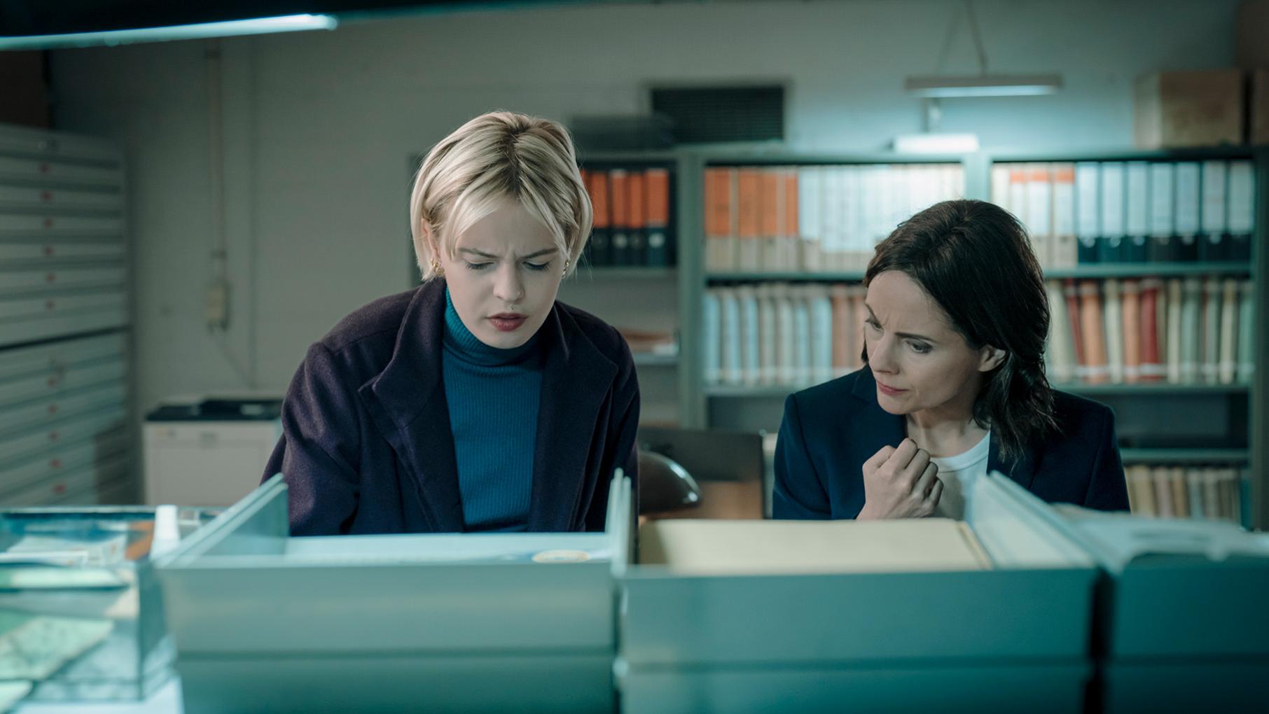 Patience and Bea look at files