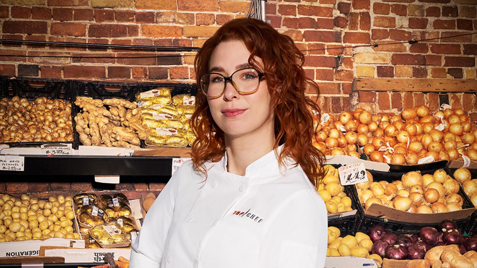 Bailey Sullivan, the executive chef of Chicago's Monteverde, was a finalist on 'Top Chef: Destination Canada.' Credit: Provided Bailey Sullivan poses in chef whites in front of produce