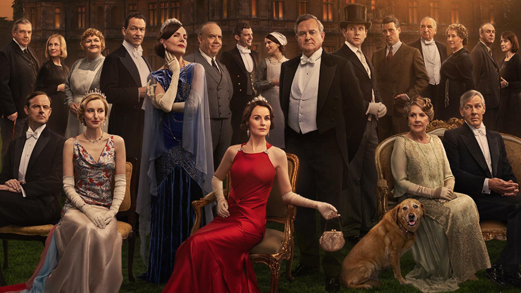 'Downton Abbey' is returning for a 'Grand Finale' in film. Credit: Focus Features (cropped) The cast of Downton Abbey: The Grand Finale arrayed in front of the manor