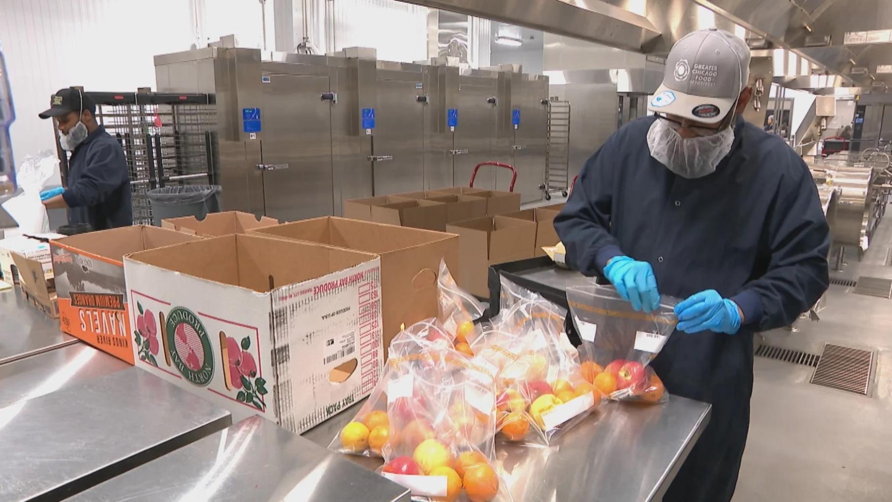 Workers pack produce at the Greater Chicago Food Depository