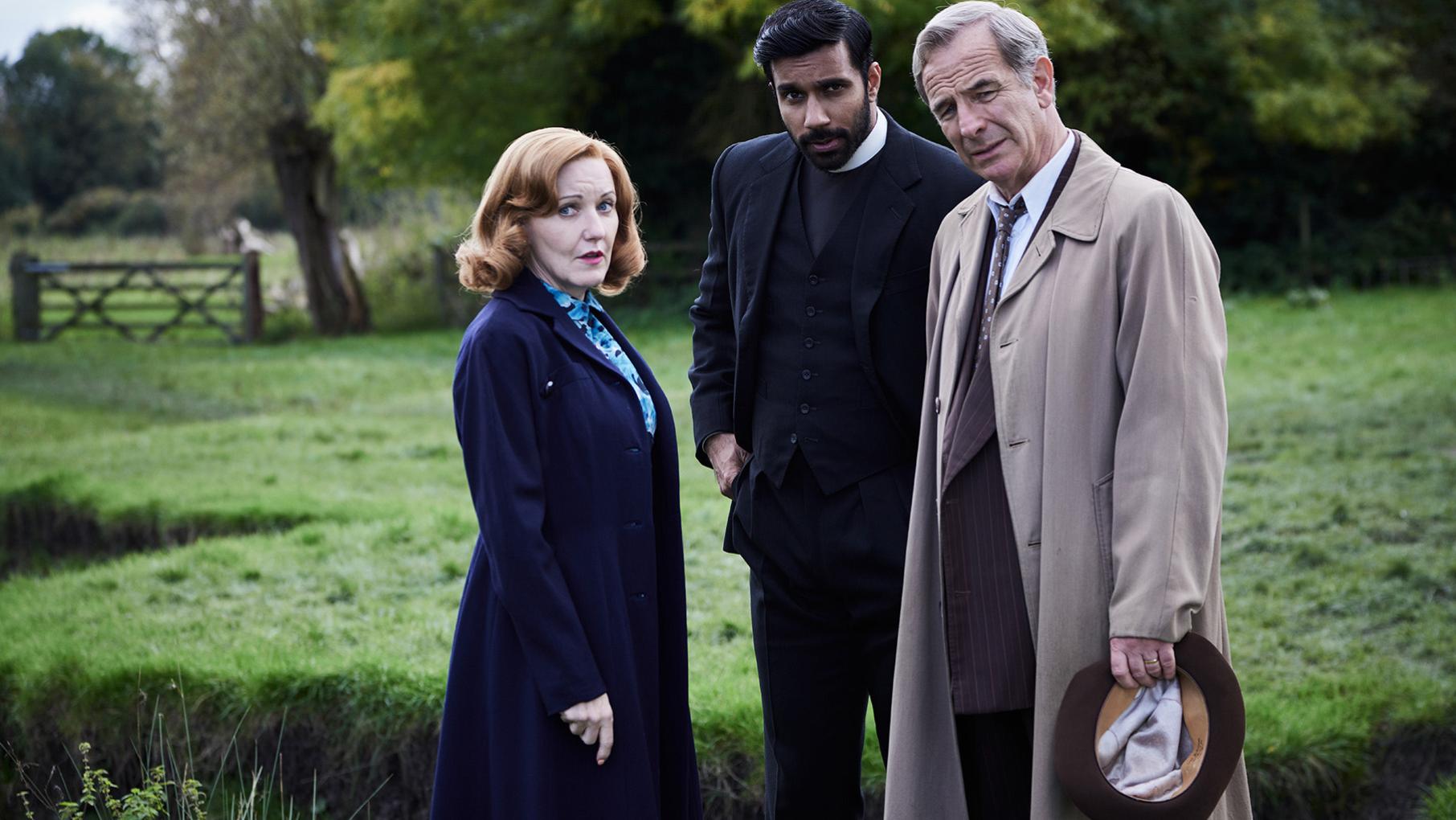 Drama threatens to derail the opening of Cathy's store, leading Alphy and Geordie to get involved. Credit: Kudos, ITV, and Masterpiece Cathy, Alphy, and Geordie stand in a meadow
